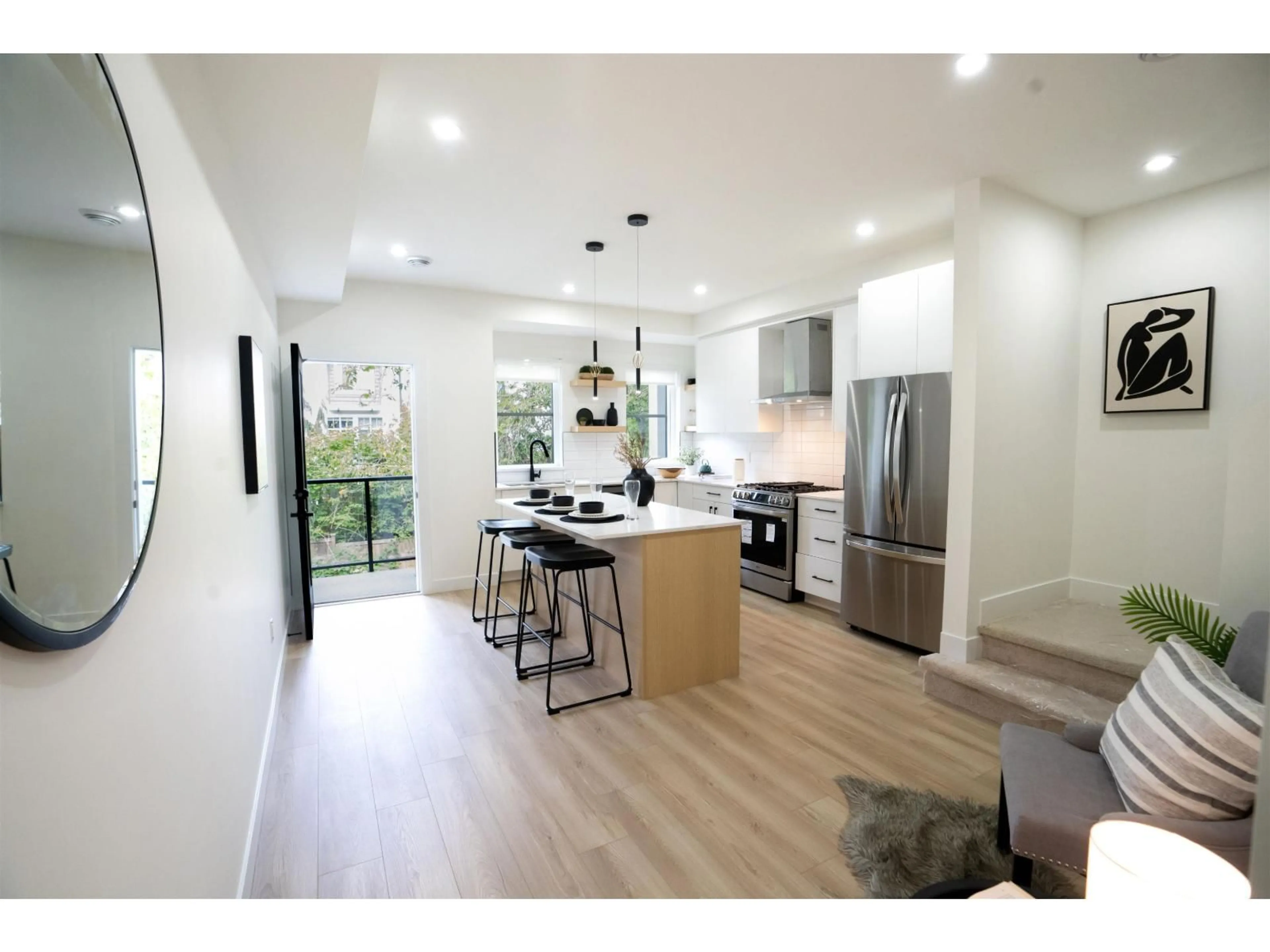 Open concept kitchen, wood/laminate floor for 13 - 14311 60 AVENUE, Surrey British Columbia V3X2N4