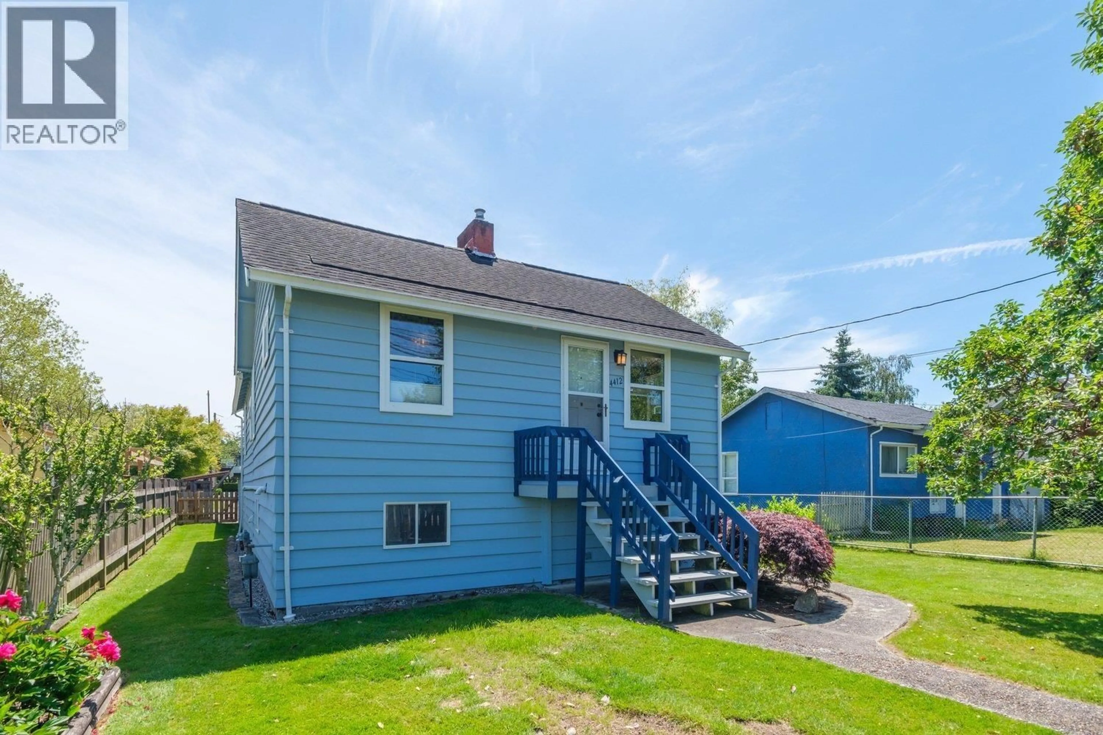 Home with vinyl exterior material, street for 4412 RIVER ROAD, Delta British Columbia V4K1S2