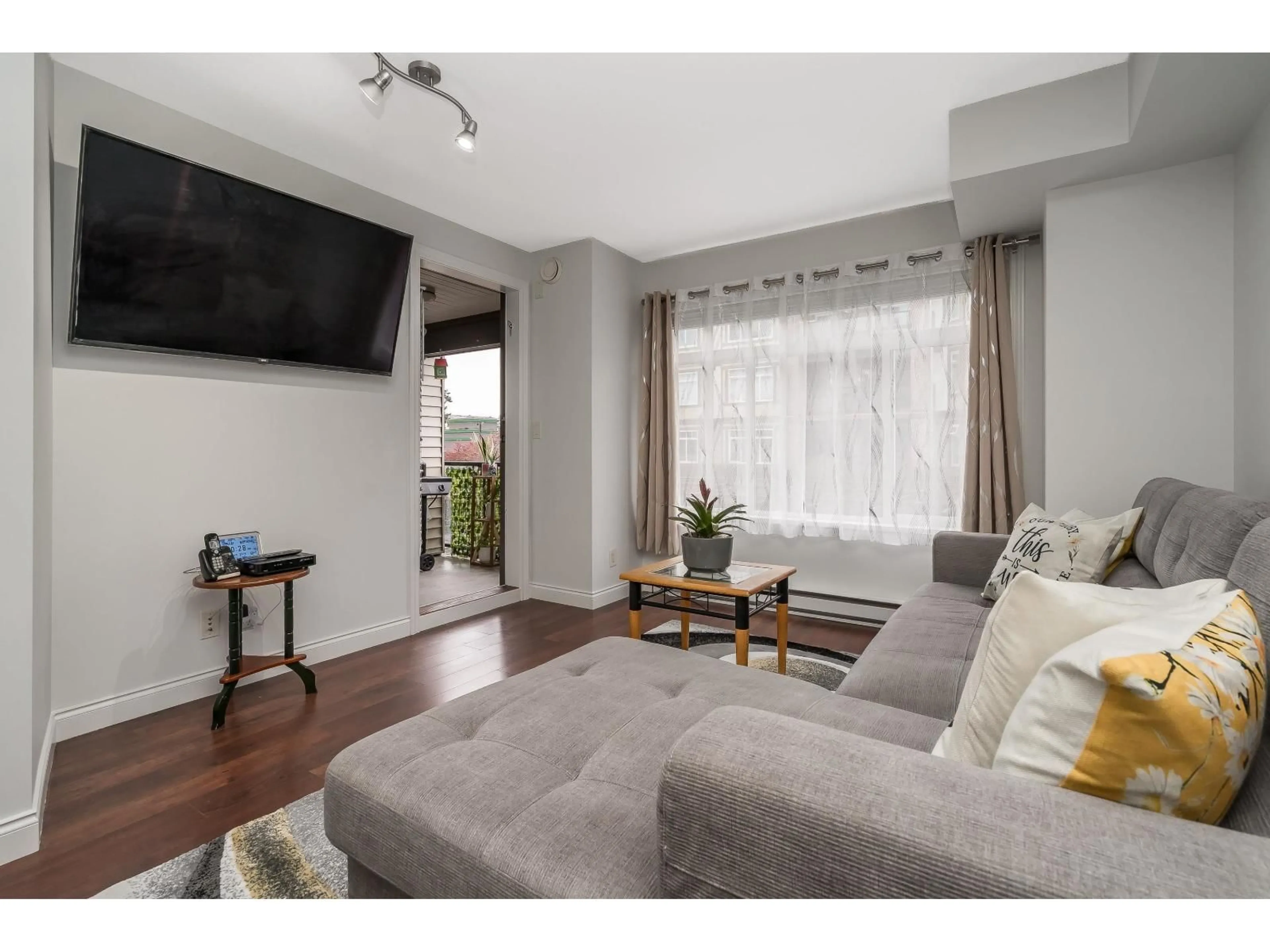 Living room with furniture, wood/laminate floor for 243 - 5660 201A STREET, Langley British Columbia V3A4E6