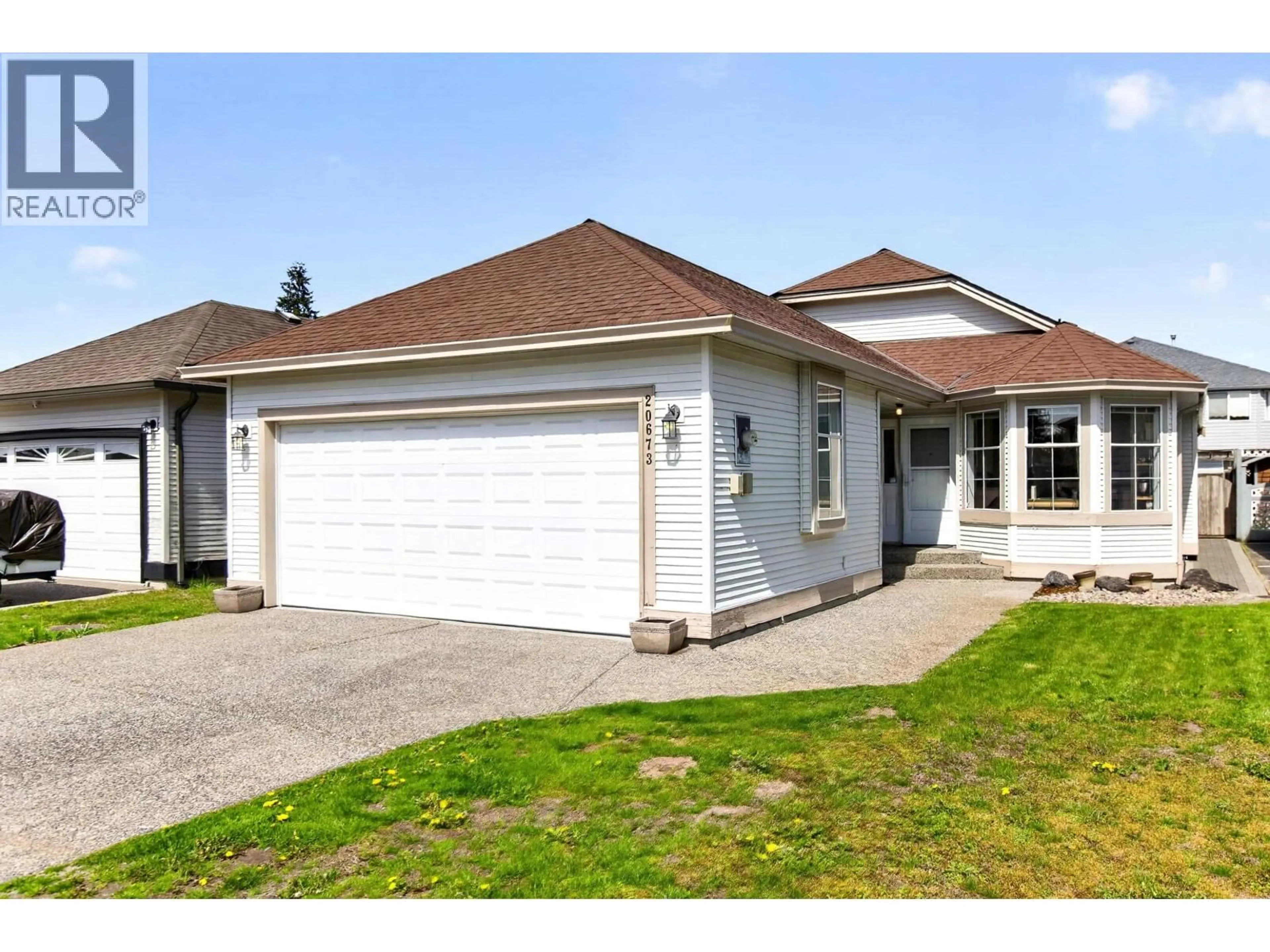 Home with vinyl exterior material, street for 20673 RIVER ROAD, Maple Ridge British Columbia V2X0P3