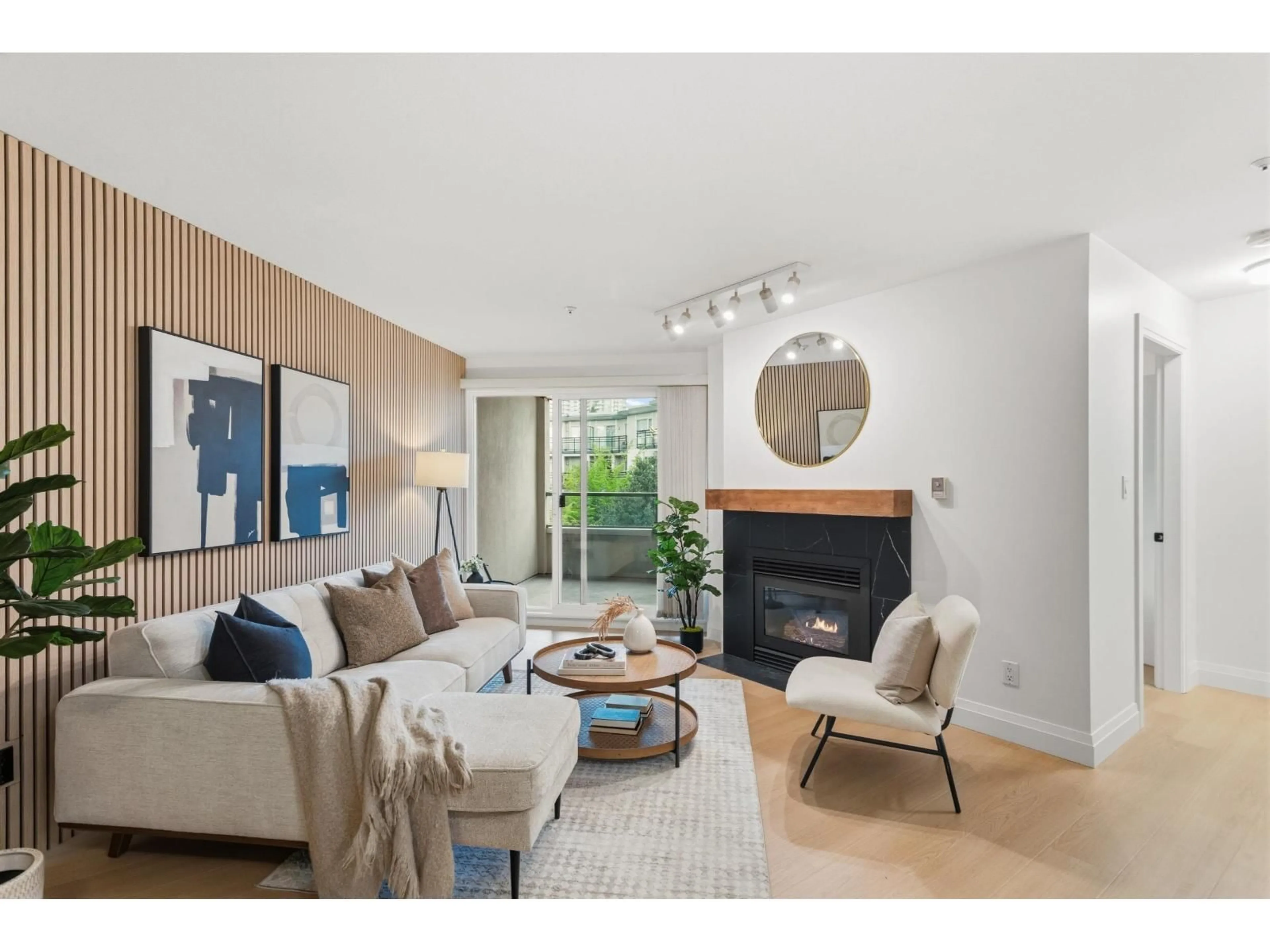 Living room with furniture, wood/laminate floor for 307 - 10128 132 STREET, Surrey British Columbia V3T3T5