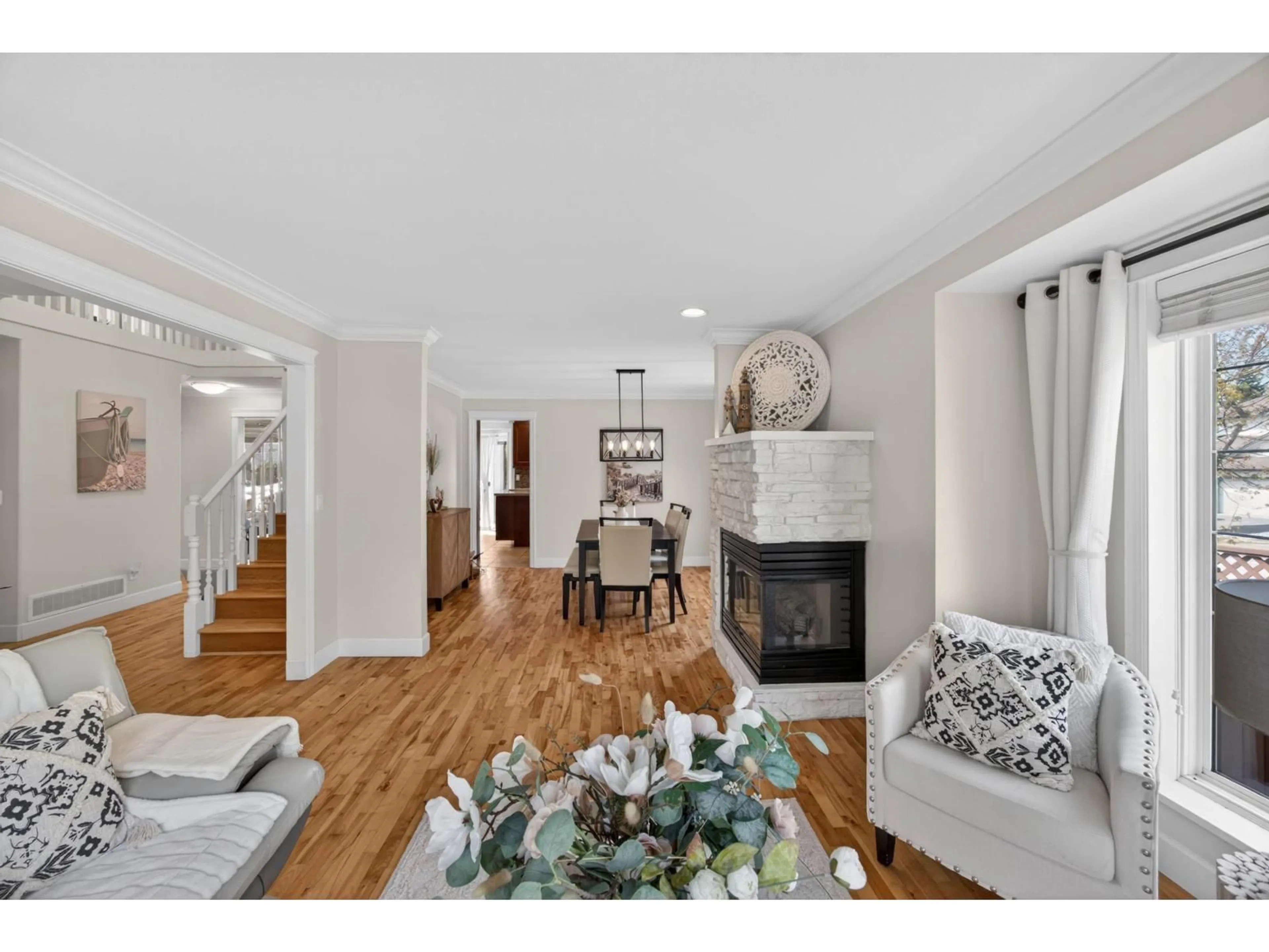 Living room with furniture, wood/laminate floor for 6791 178B STREET, Surrey British Columbia V3S9E1