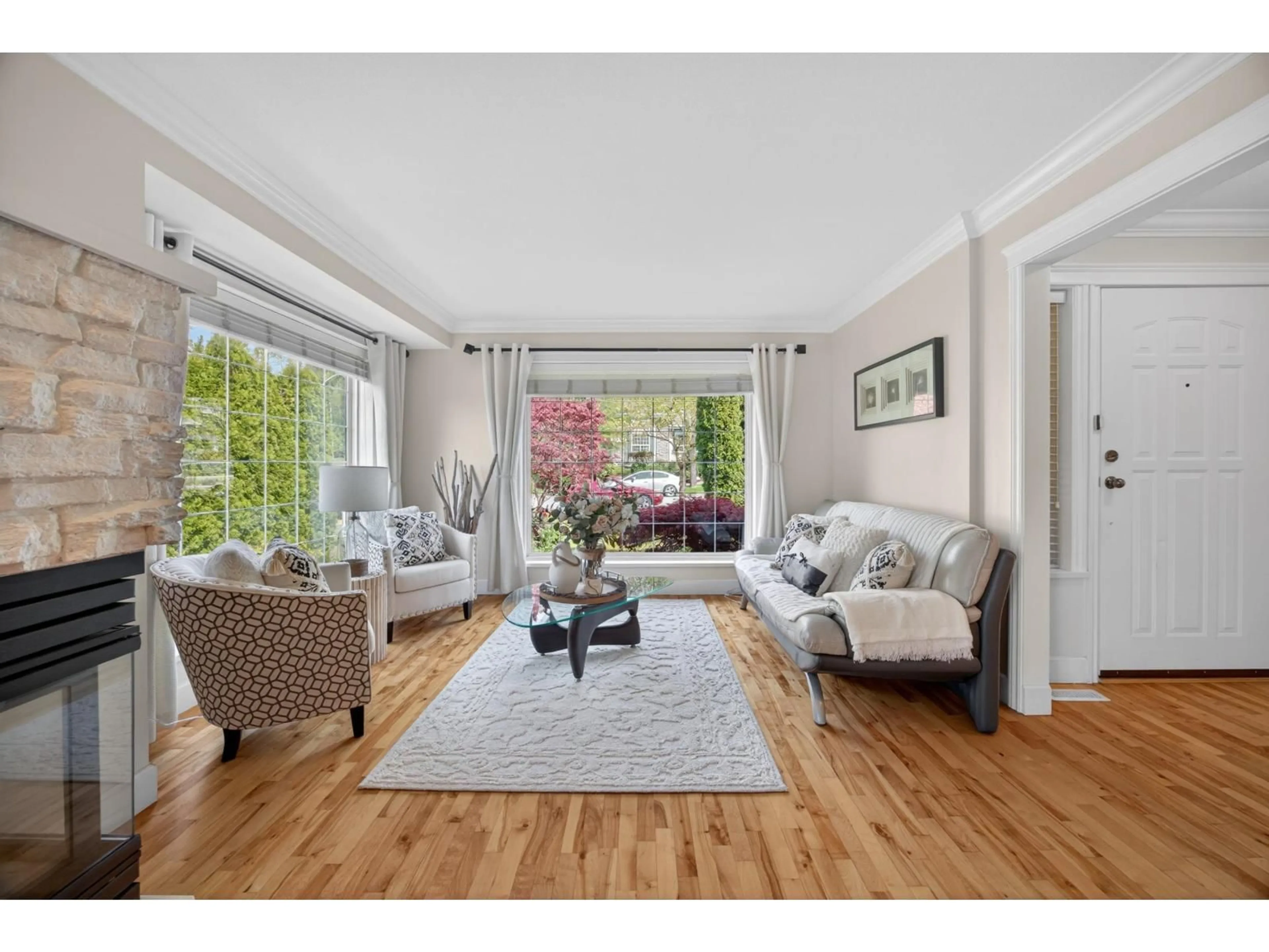 Living room with furniture, wood/laminate floor for 6791 178B STREET, Surrey British Columbia V3S9E1