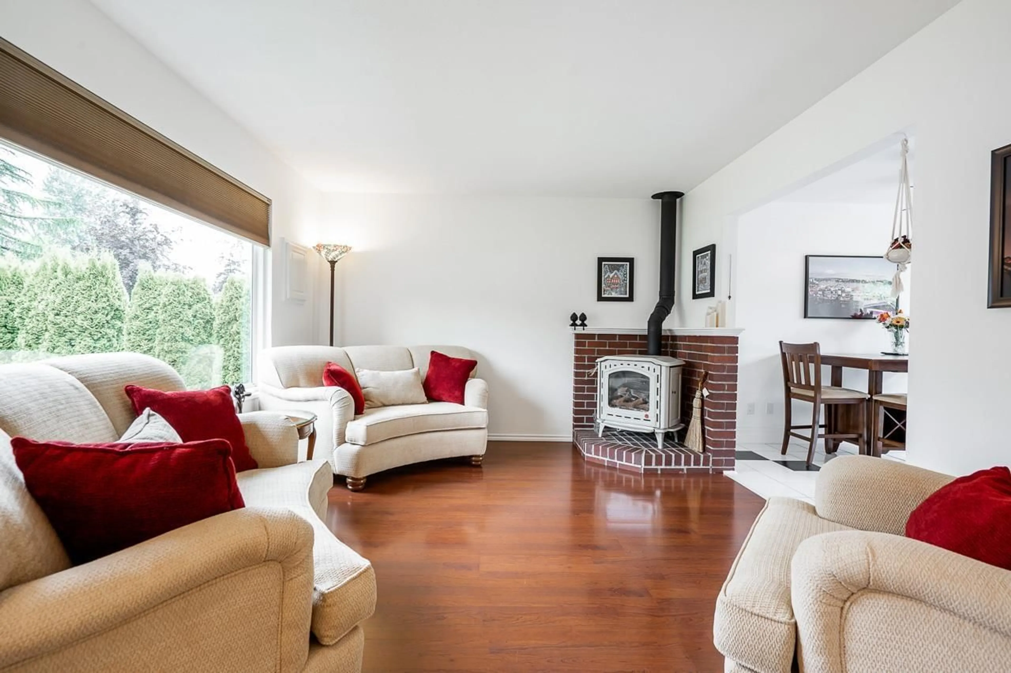 Living room with furniture, wood/laminate floor for 27145 27B AVENUE, Langley British Columbia V4W3C2