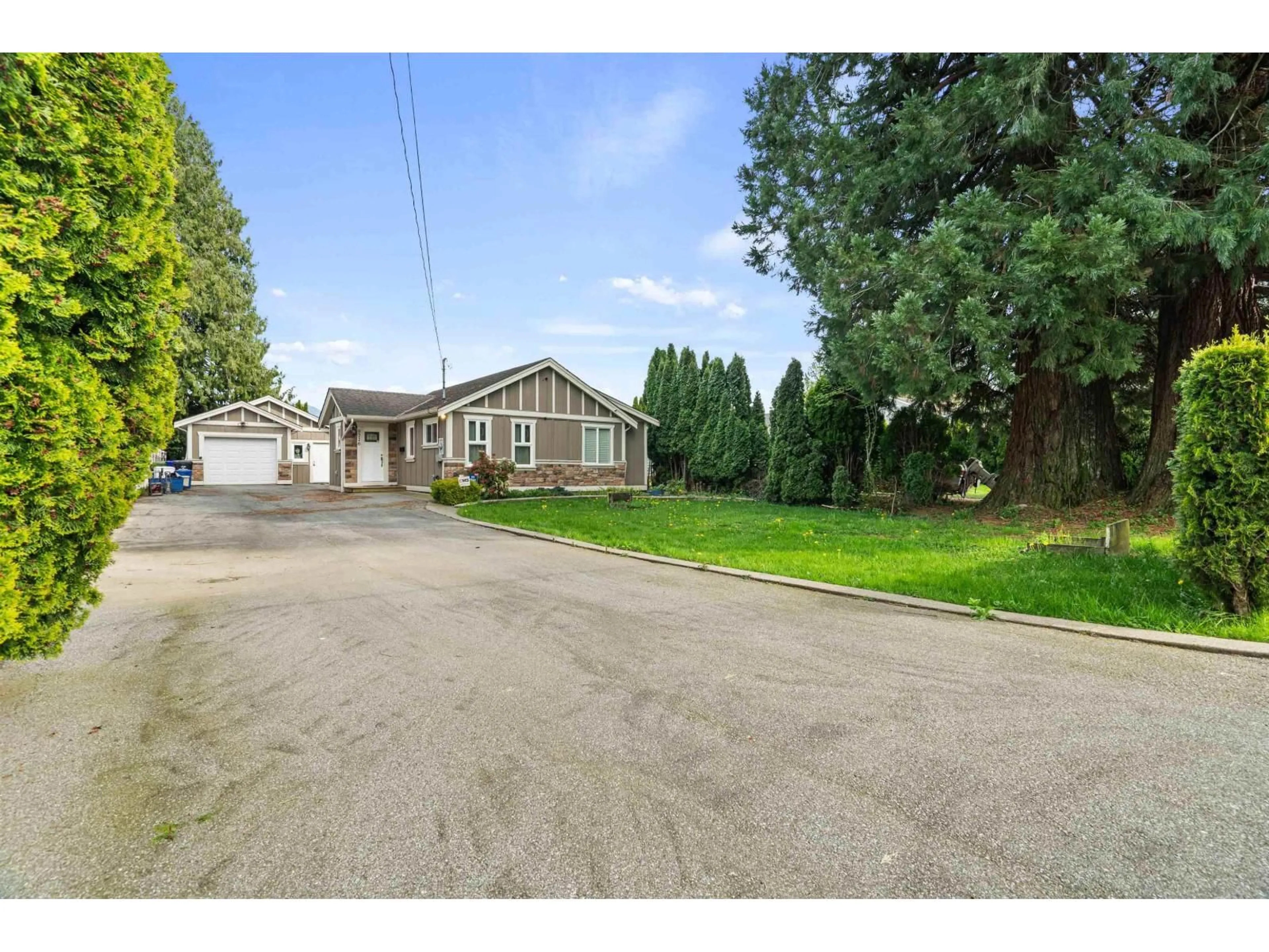 A pic from outside/outdoor area/front of a property/back of a property/a pic from drone, street for 9716 CORBOULD STREET, Chilliwack British Columbia V2P4B5