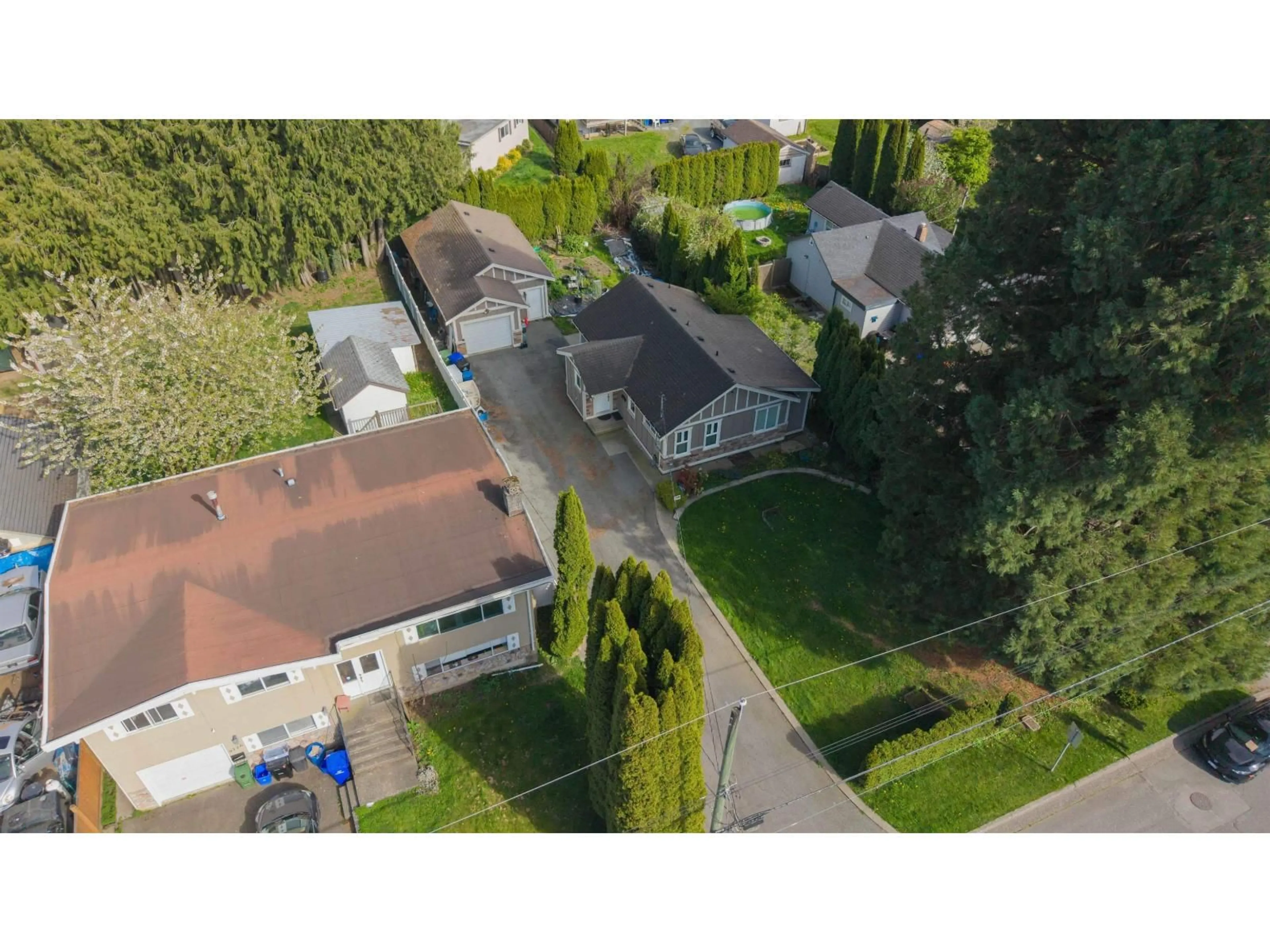 A pic from outside/outdoor area/front of a property/back of a property/a pic from drone, street for 9716 CORBOULD STREET, Chilliwack British Columbia V2P4B5