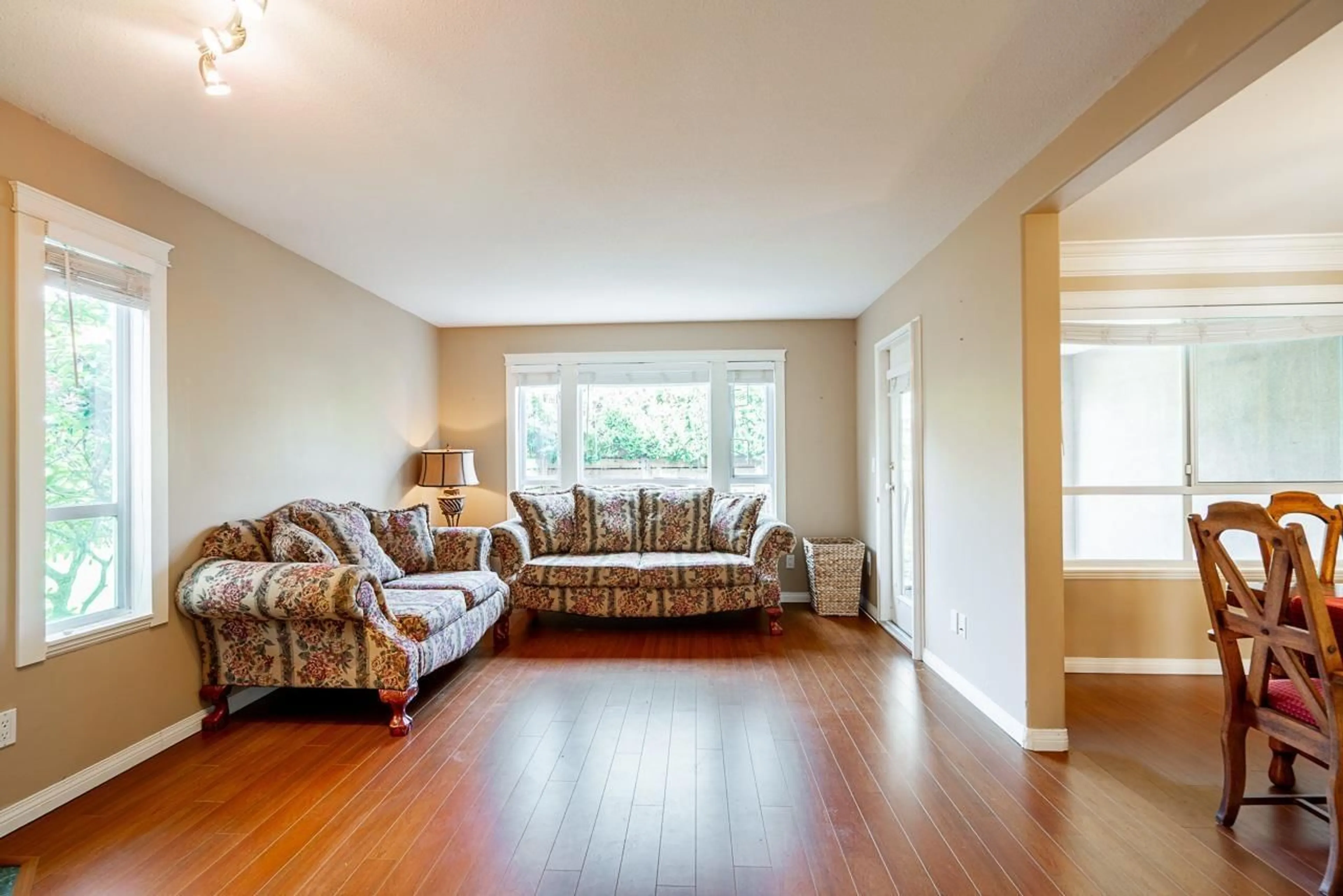 Living room with furniture, wood/laminate floor for 134 - 15550 26 AVENUE, Surrey British Columbia V4P1C6