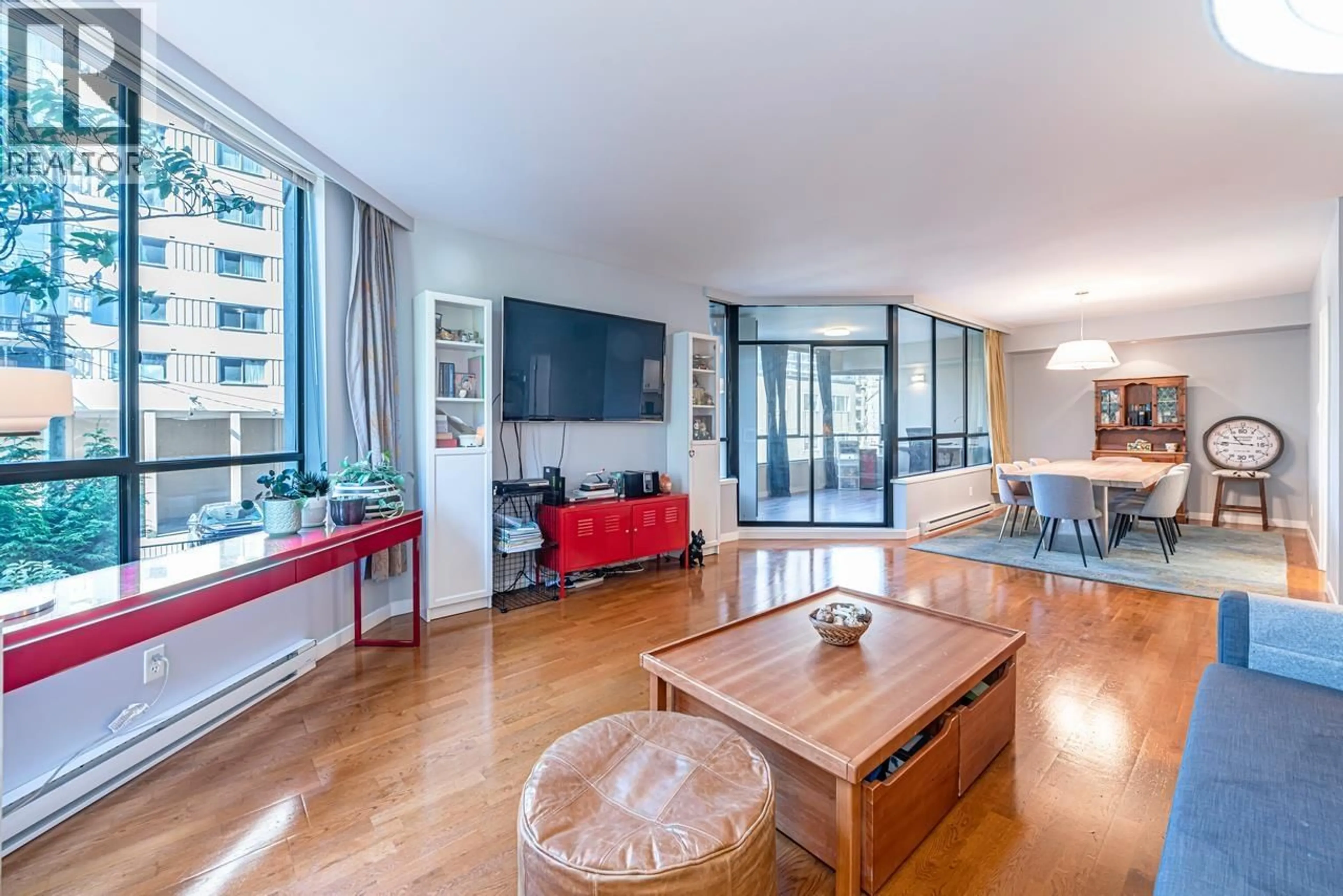 Living room with furniture, wood/laminate floor for 203 - 738 BROUGHTON STREET, Vancouver British Columbia V6G3A7