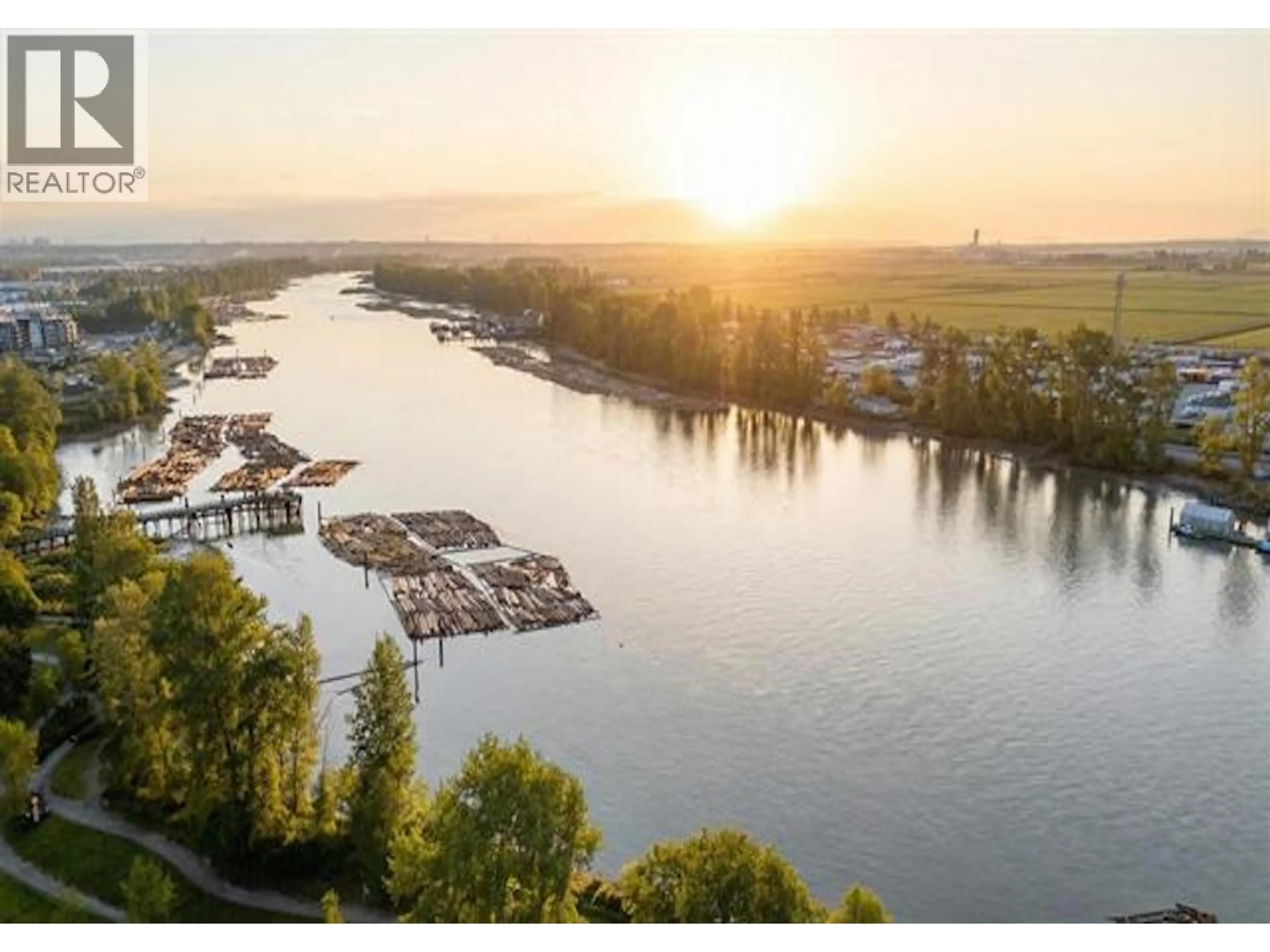 A pic from outside/outdoor area/front of a property/back of a property/a pic from drone, water/lake/river/ocean view for 101 - 8460 JELLICOE STREET, Vancouver British Columbia V5S4S8