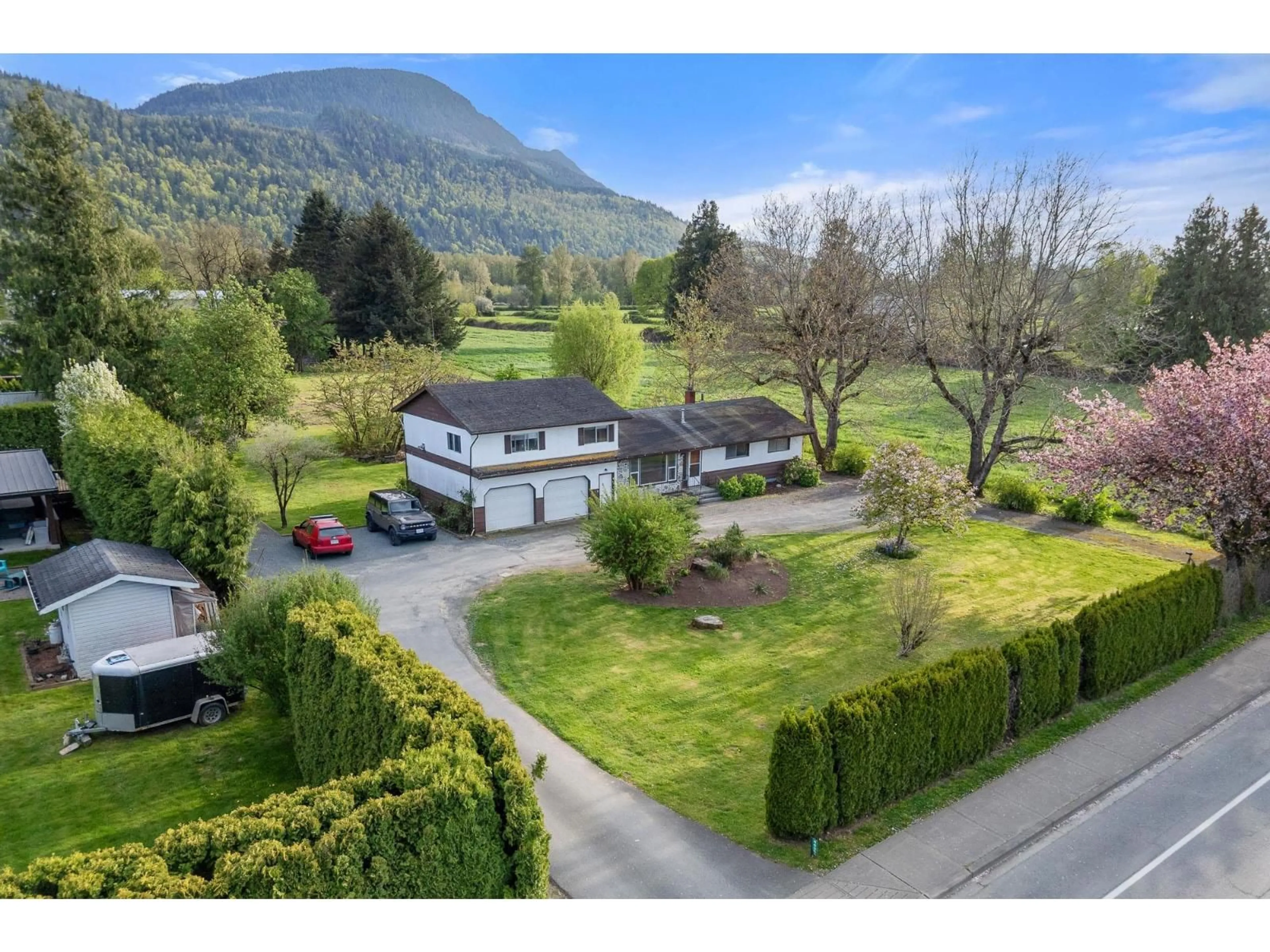 A pic from outside/outdoor area/front of a property/back of a property/a pic from drone, mountain view for 44366 KEITH WILSON ROAD, Chilliwack British Columbia V2R4B6