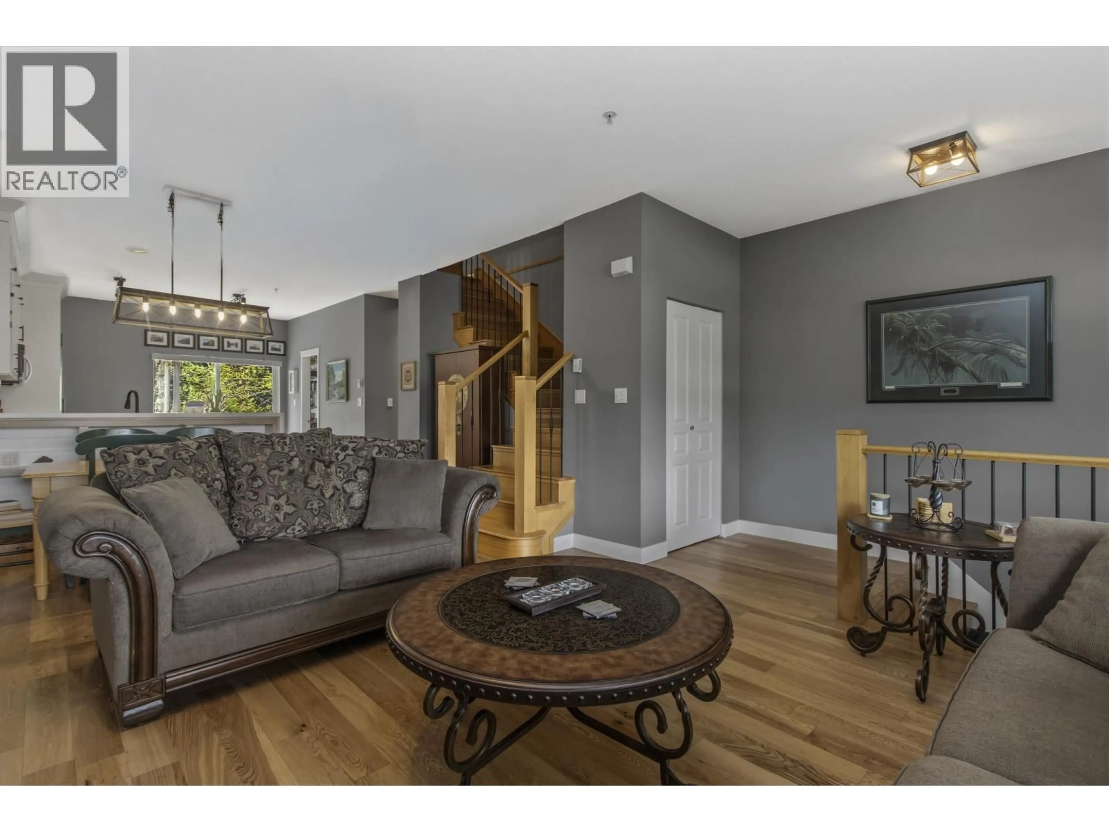 Living room with furniture, wood/laminate floor for 12 - 1800 MAMQUAM ROAD, Squamish British Columbia V8B0J1