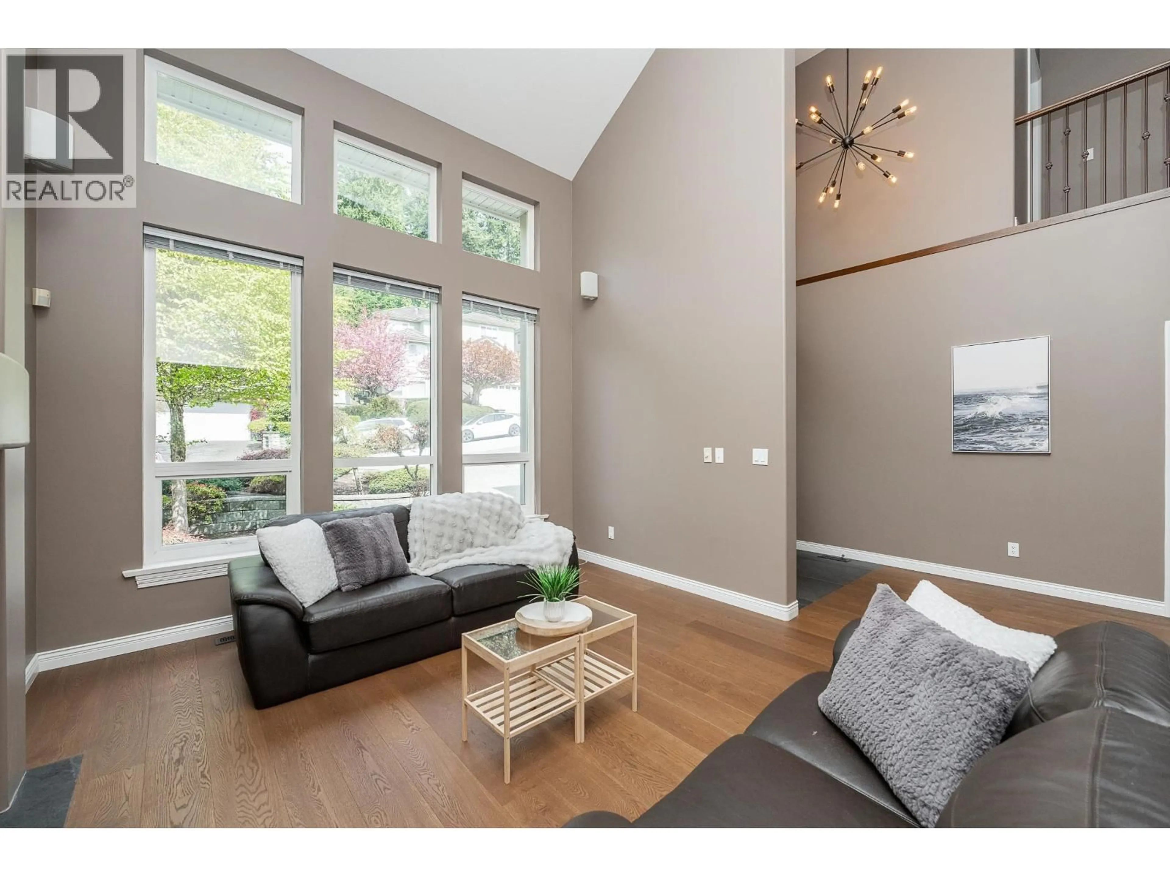 Living room with furniture, wood/laminate floor for 64 WILKES CREEK DRIVE, Port Moody British Columbia V3H4Z9