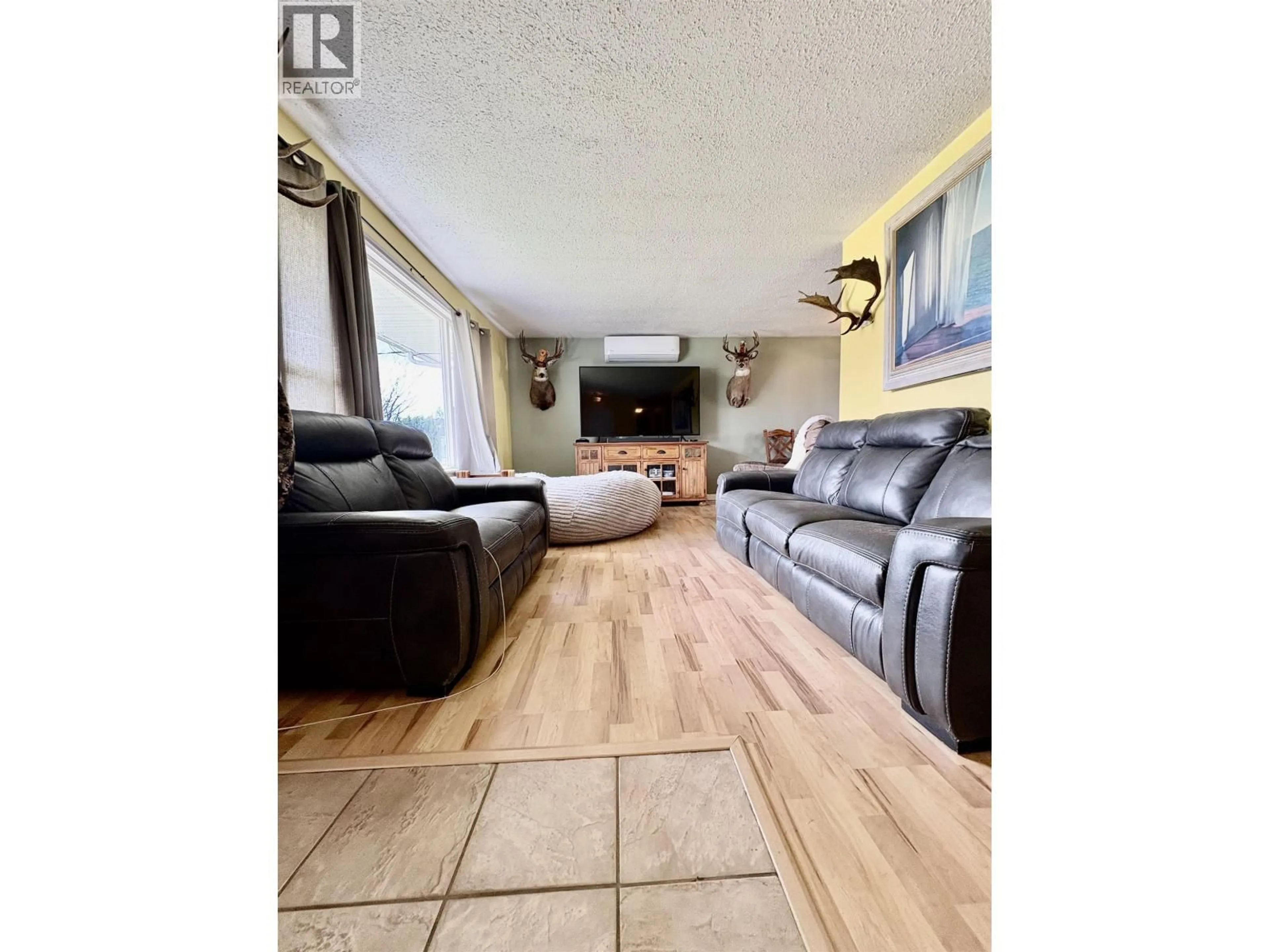 Living room with furniture, wood/laminate floor for 2307 EVERGREEN STREET, Terrace British Columbia V8G4S6