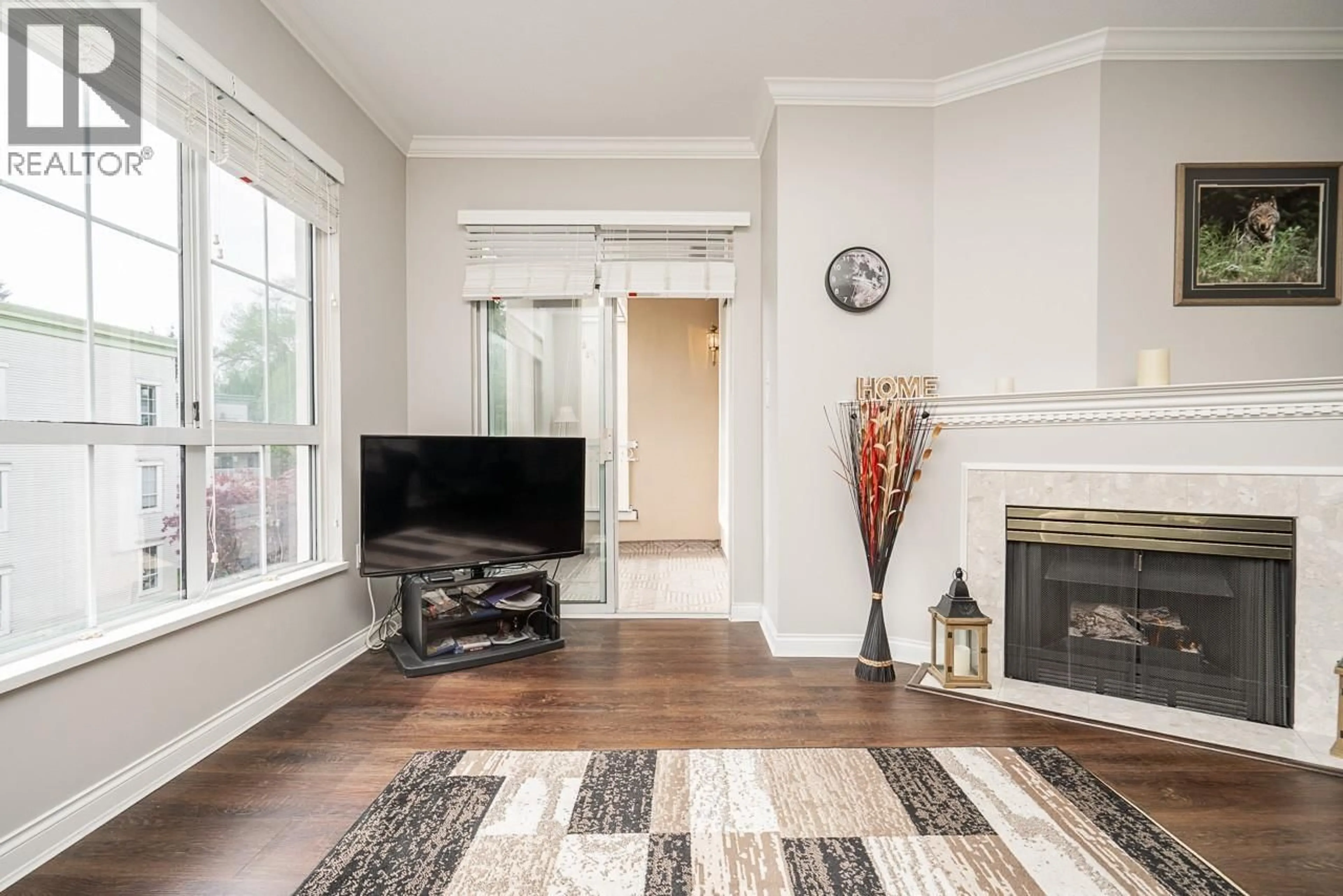 Living room with furniture, wood/laminate floor for 316 - 2985 PRINCESS CRESCENT, Coquitlam British Columbia V3B7P3