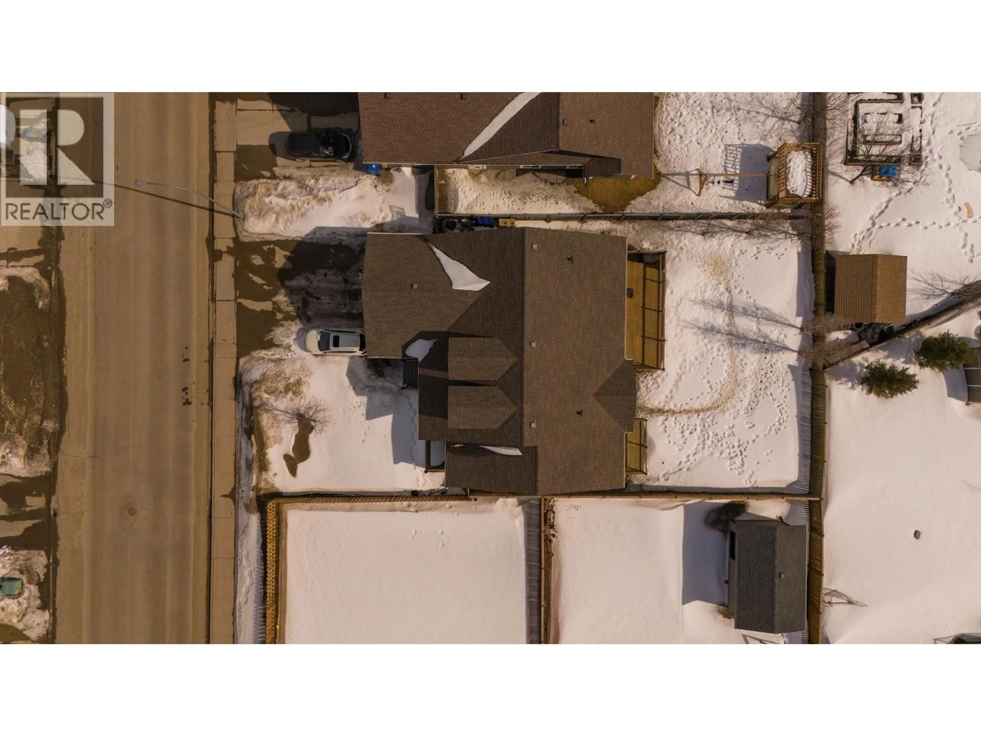 A pic from outside/outdoor area/front of a property/back of a property/a pic from drone, building for 8711 112 AVENUE, Fort St. John British Columbia V1J0H9