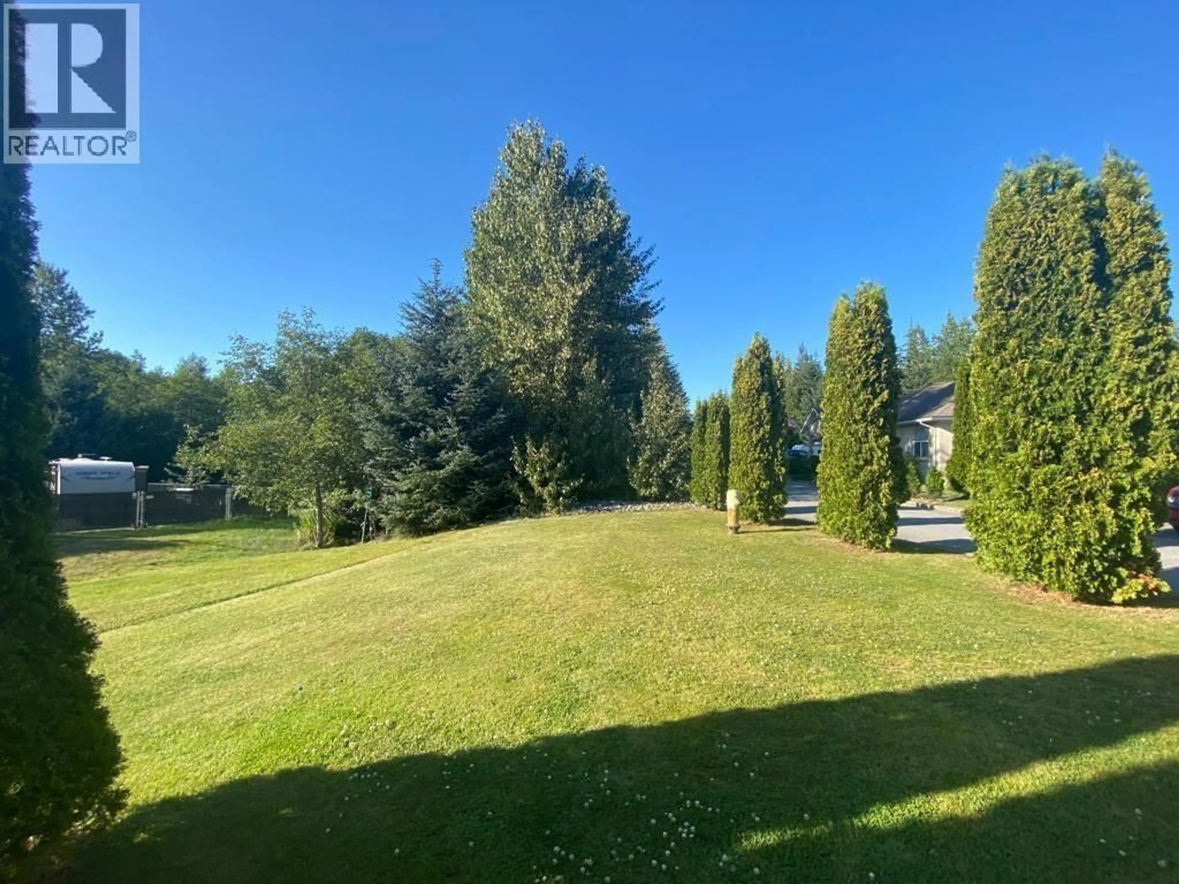 A pic from outside/outdoor area/front of a property/back of a property/a pic from drone, forest/trees view for 1 - 90 SMITH STREET, Kitimat British Columbia V8C2R5