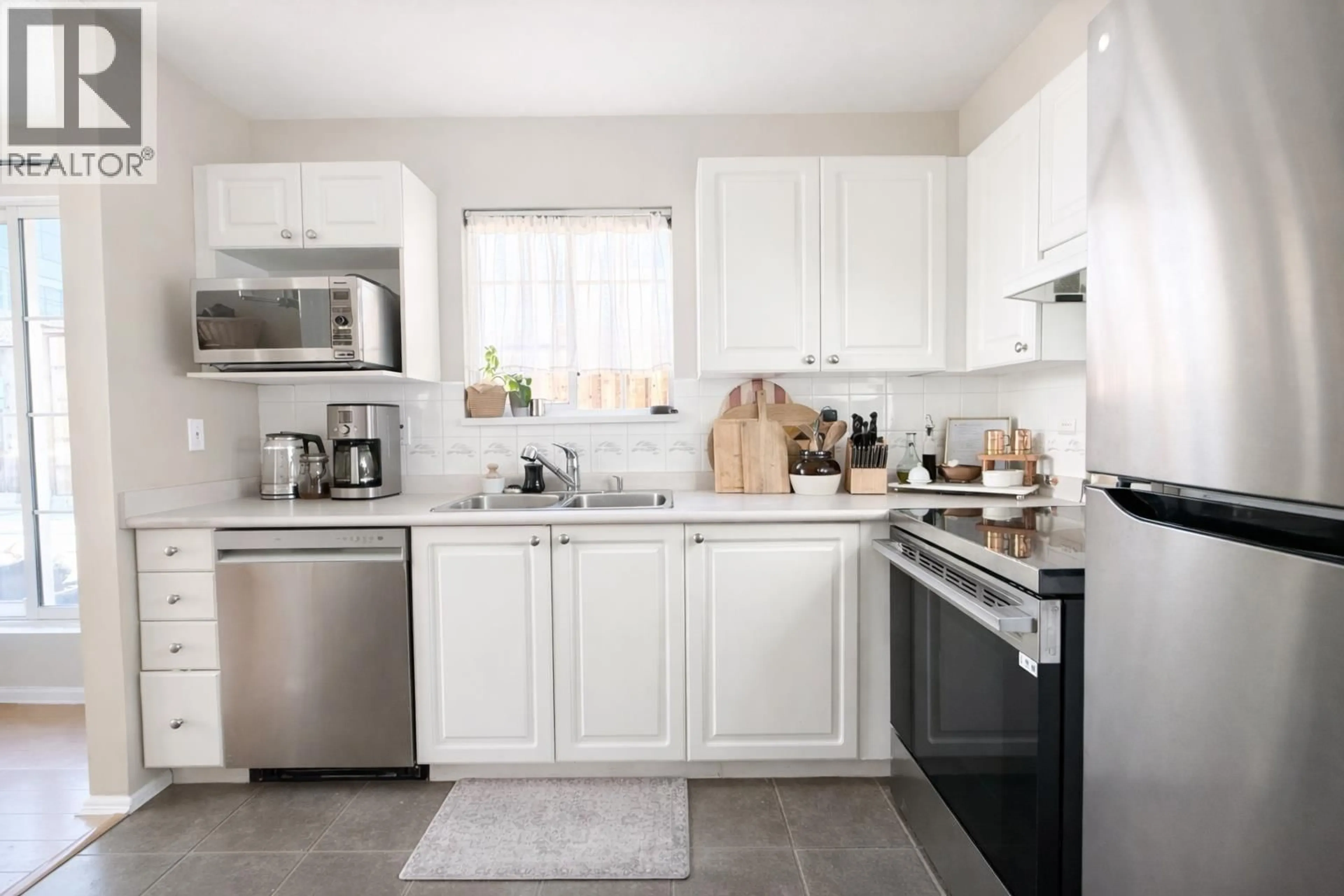 Open concept kitchen, ceramic/tile floor for 315 - 888 GAUTHIER AVENUE, Coquitlam British Columbia V3K6Y1