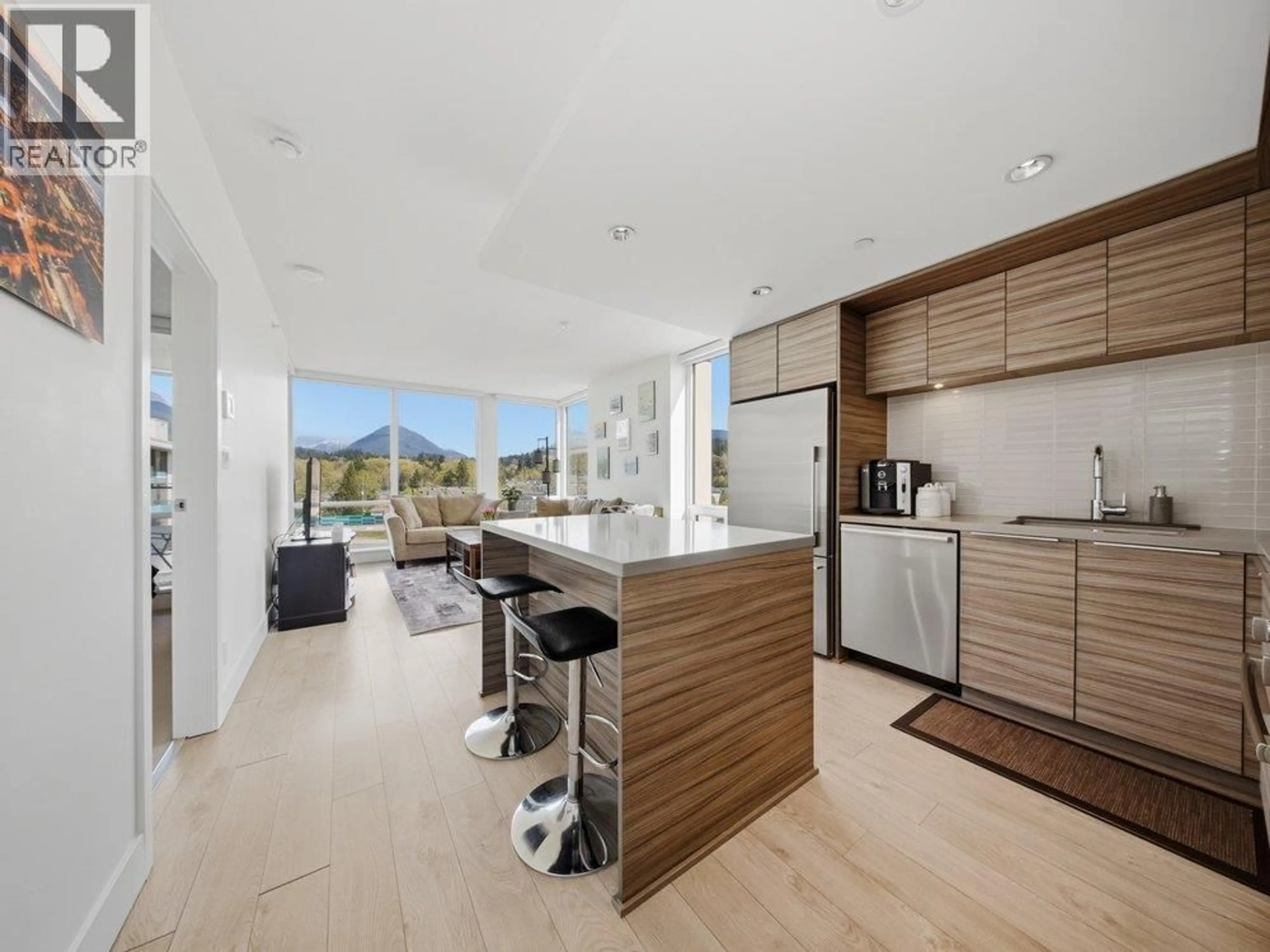 Open concept kitchen, wood/laminate floor for 602 - 1550 FERN STREET, North Vancouver British Columbia V7J0A9