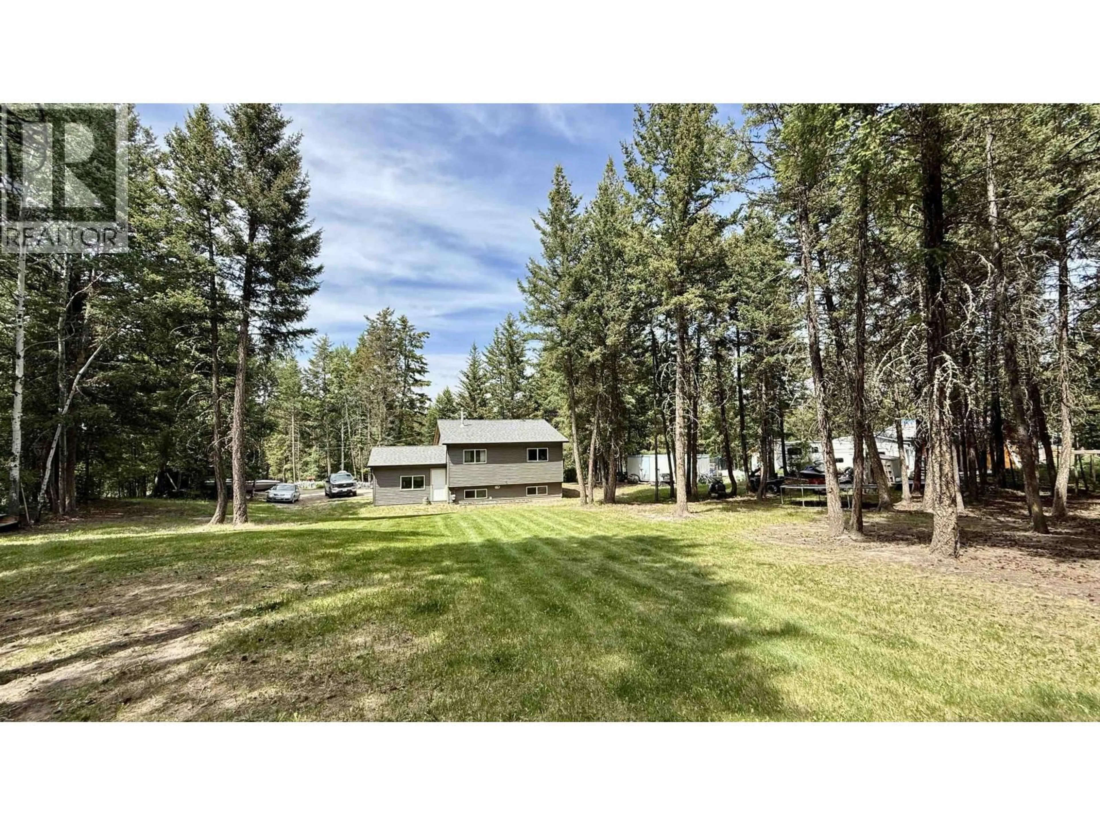 A pic from outside/outdoor area/front of a property/back of a property/a pic from drone, forest/trees view for 4755 ANZEEON ROAD, 108 Mile Ranch British Columbia V0K2Z0
