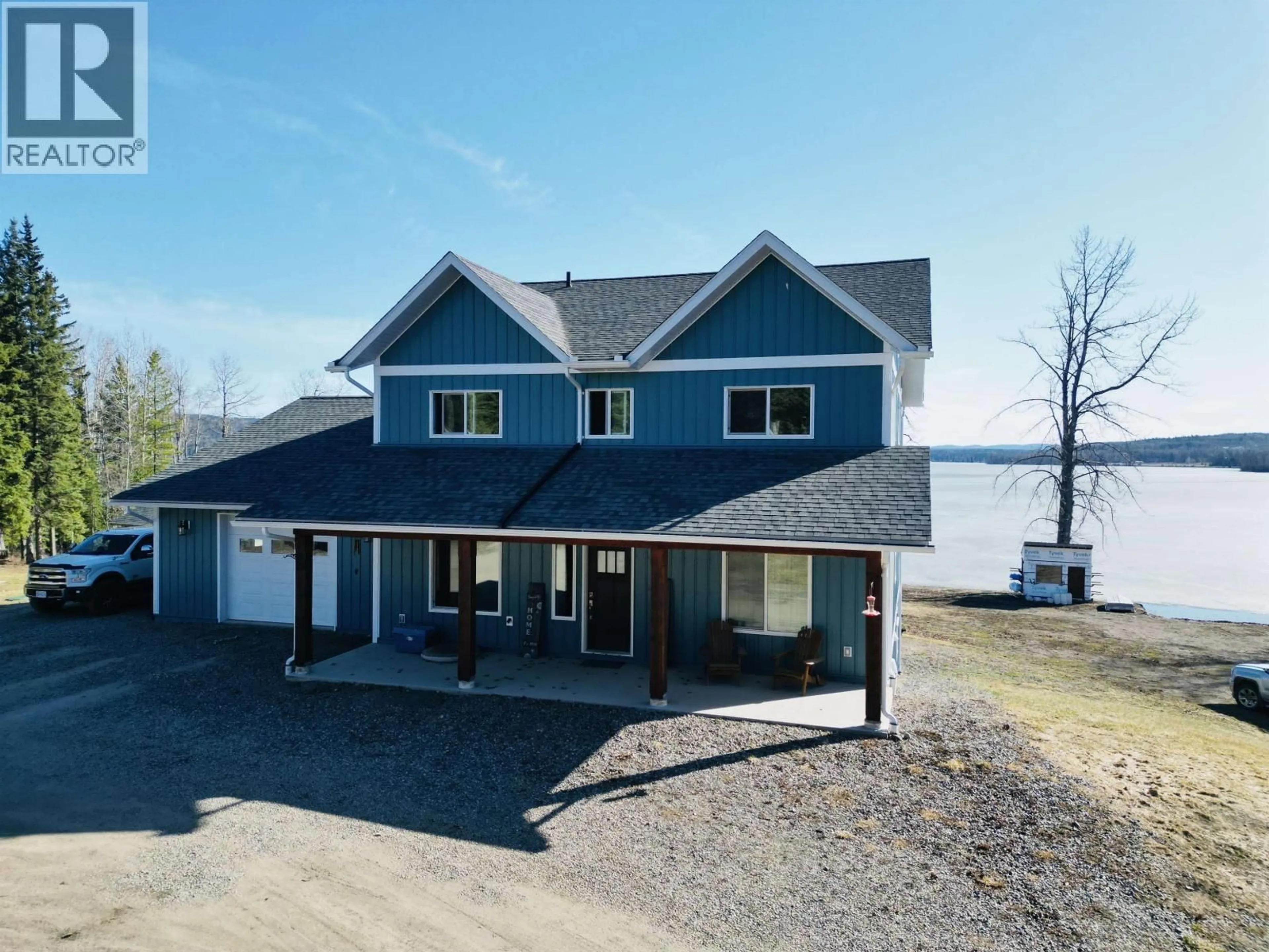 A pic from outside/outdoor area/front of a property/back of a property/a pic from drone, water/lake/river/ocean view for 3789 TCHESINKUT ROAD, Burns Lake British Columbia V0J1E2