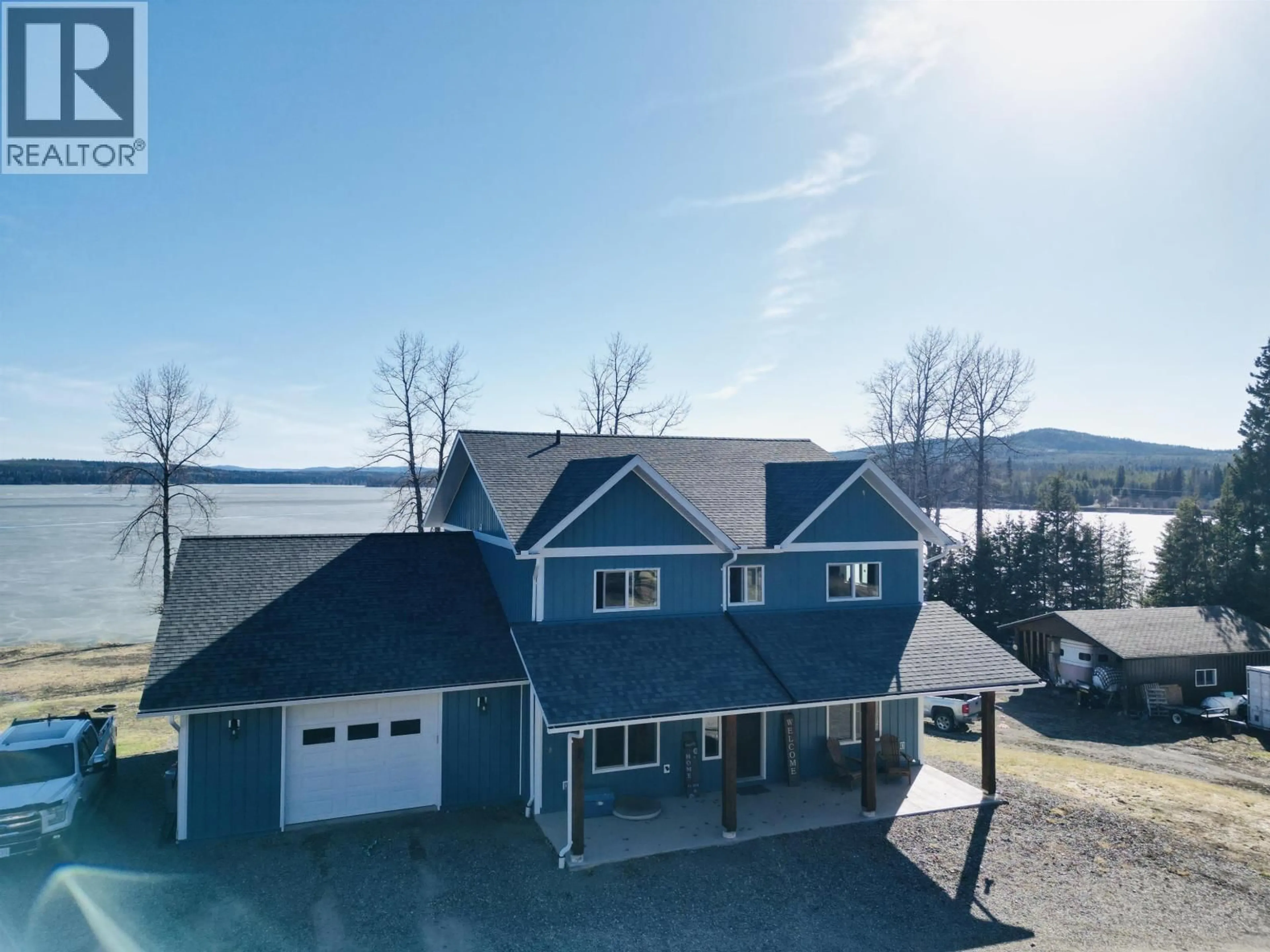 A pic from outside/outdoor area/front of a property/back of a property/a pic from drone, water/lake/river/ocean view for 3789 TCHESINKUT ROAD, Burns Lake British Columbia V0J1E2