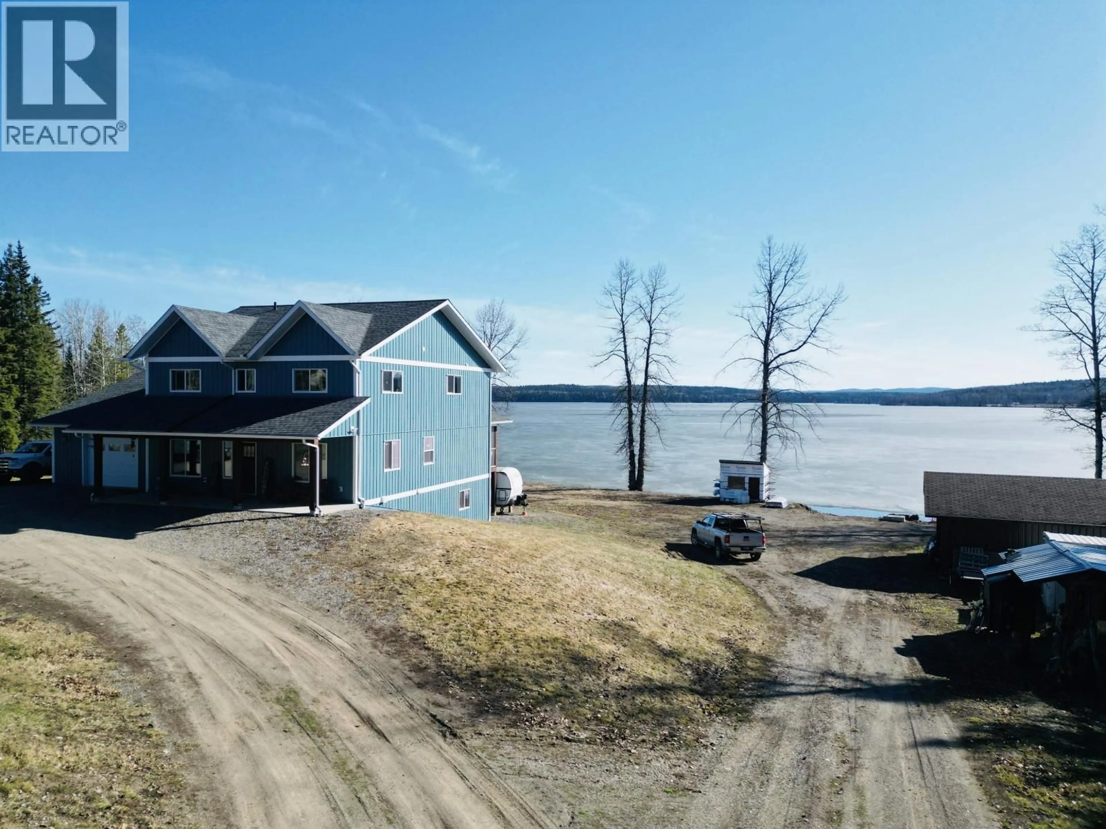 A pic from outside/outdoor area/front of a property/back of a property/a pic from drone, water/lake/river/ocean view for 3789 TCHESINKUT ROAD, Burns Lake British Columbia V0J1E2