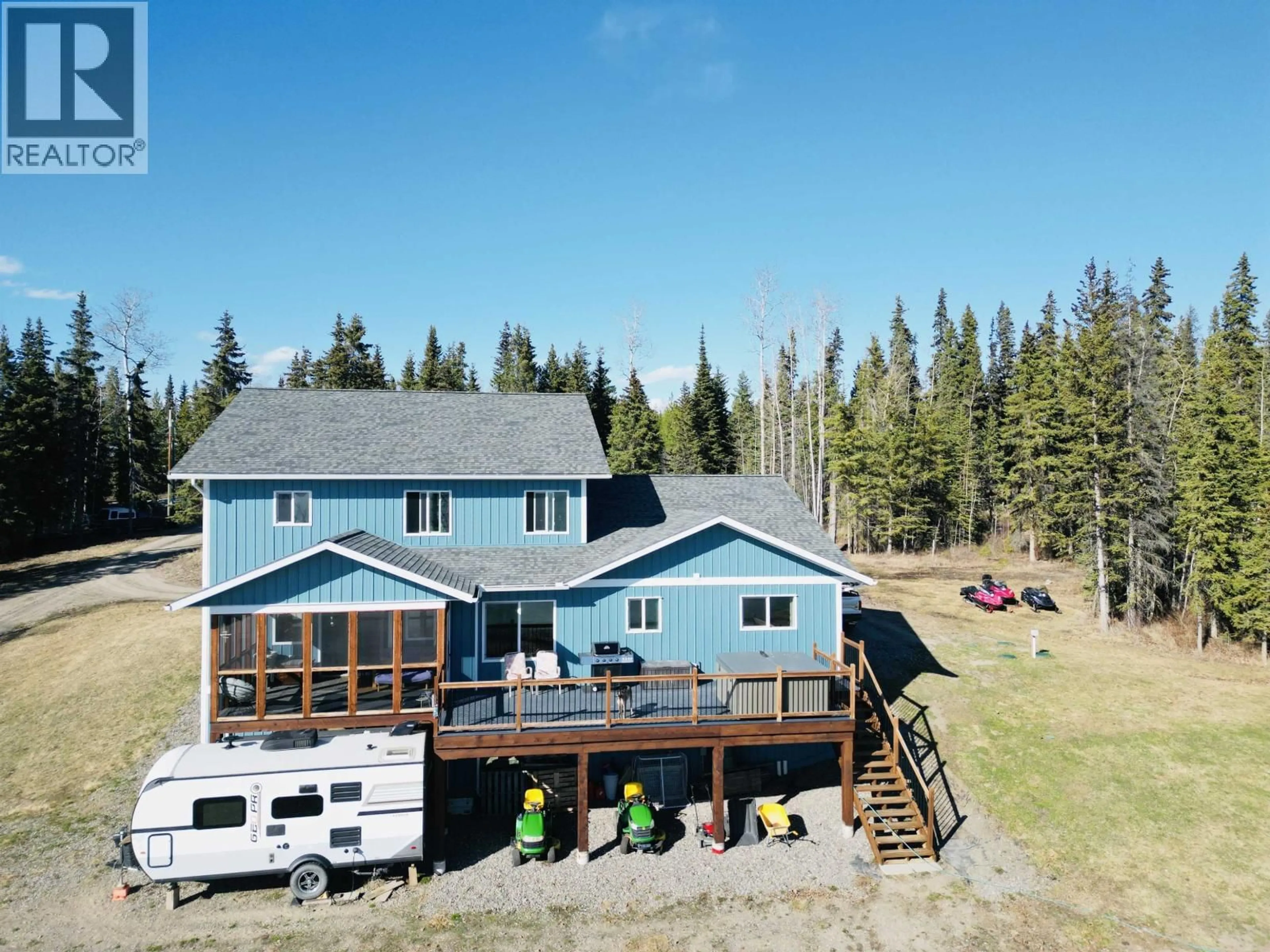 A pic from outside/outdoor area/front of a property/back of a property/a pic from drone, water/lake/river/ocean view for 3789 TCHESINKUT ROAD, Burns Lake British Columbia V0J1E2