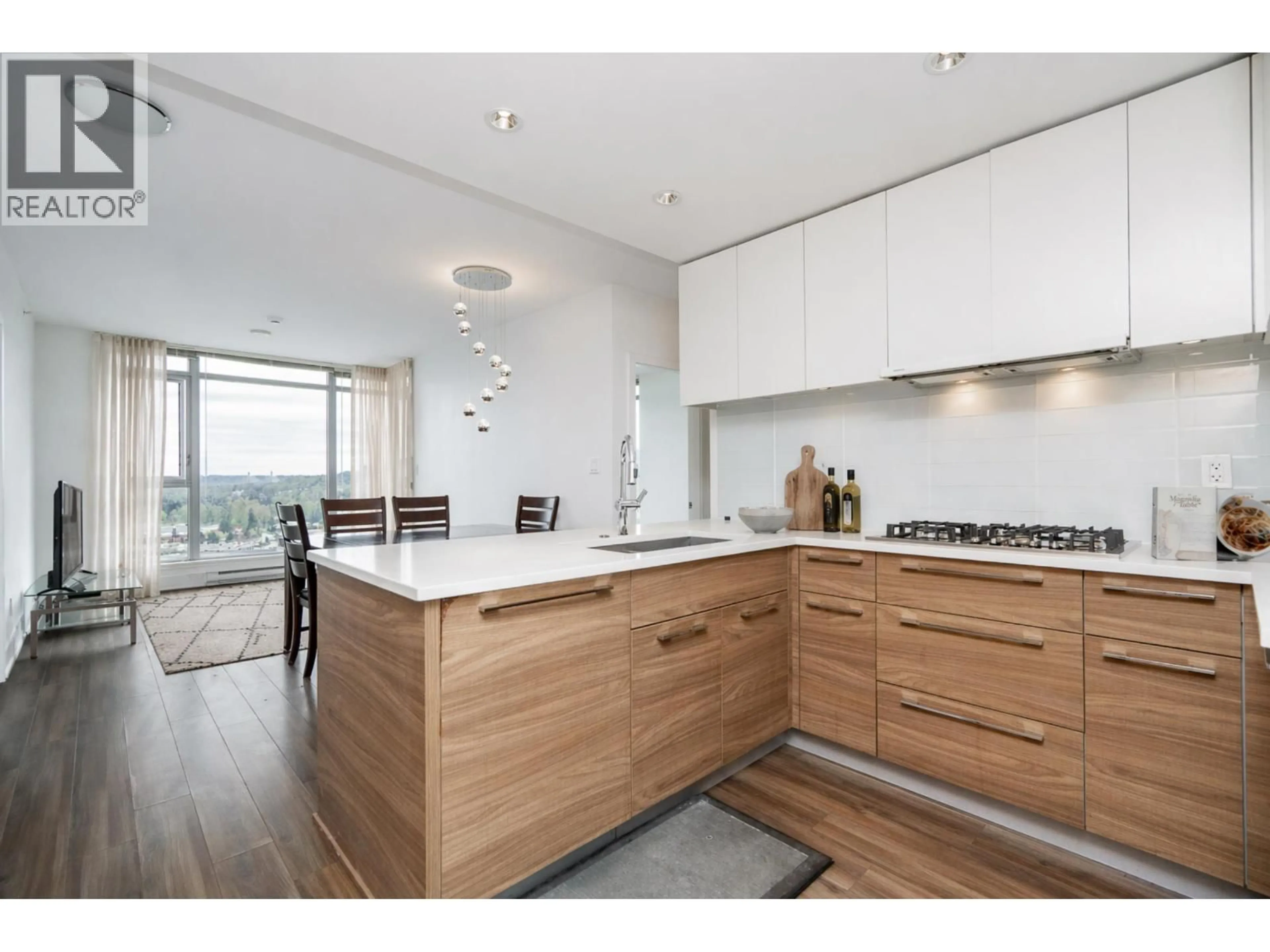 Open concept kitchen, wood/laminate floor for 2501 - 1188 PINETREE WAY, Coquitlam British Columbia V3B0K9