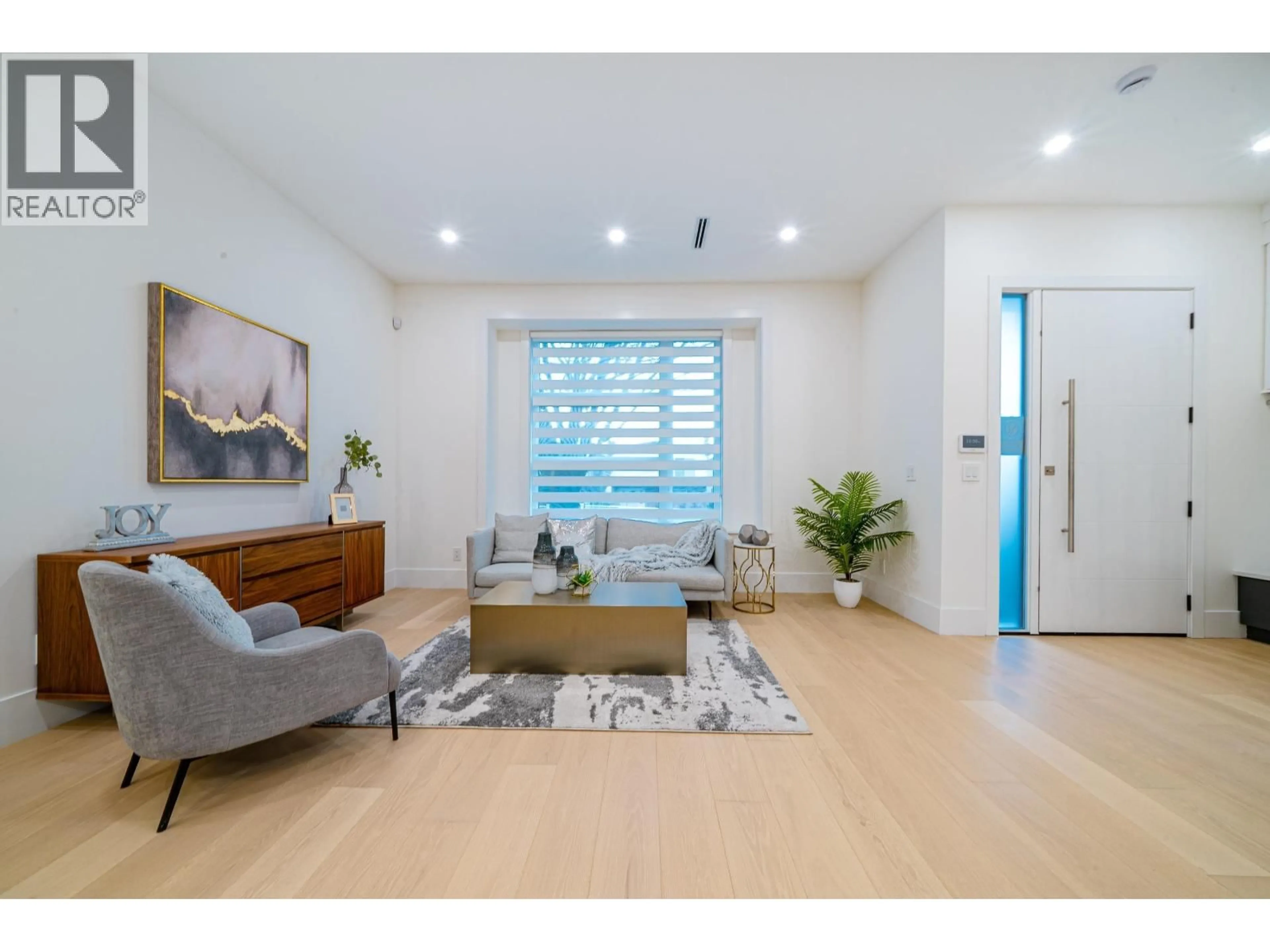 Living room with furniture, wood/laminate floor for 2 - 4210 UNION STREET, Burnaby British Columbia V5C2X4