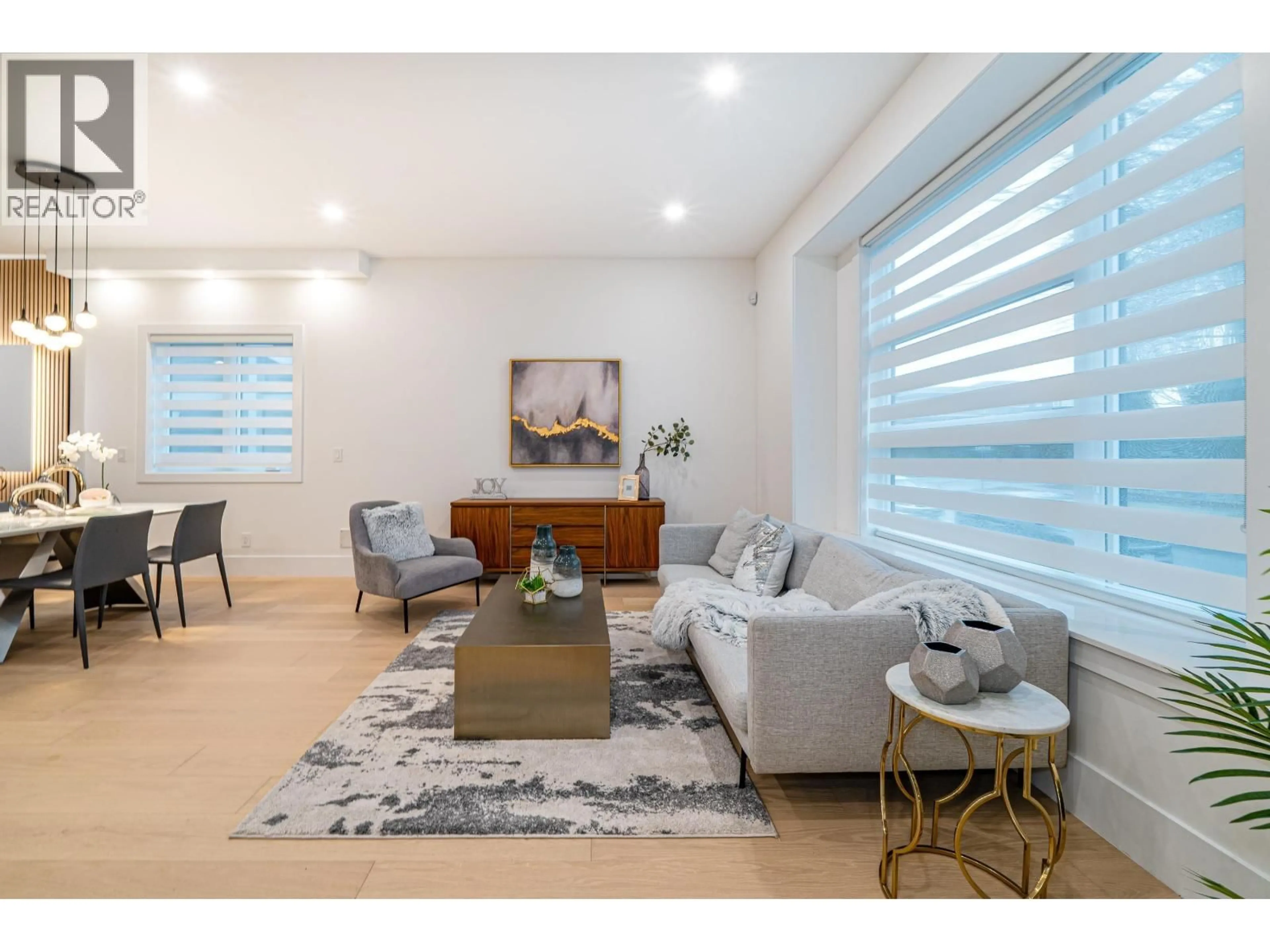 Living room with furniture, wood/laminate floor for 2 - 4210 UNION STREET, Burnaby British Columbia V5C2X4