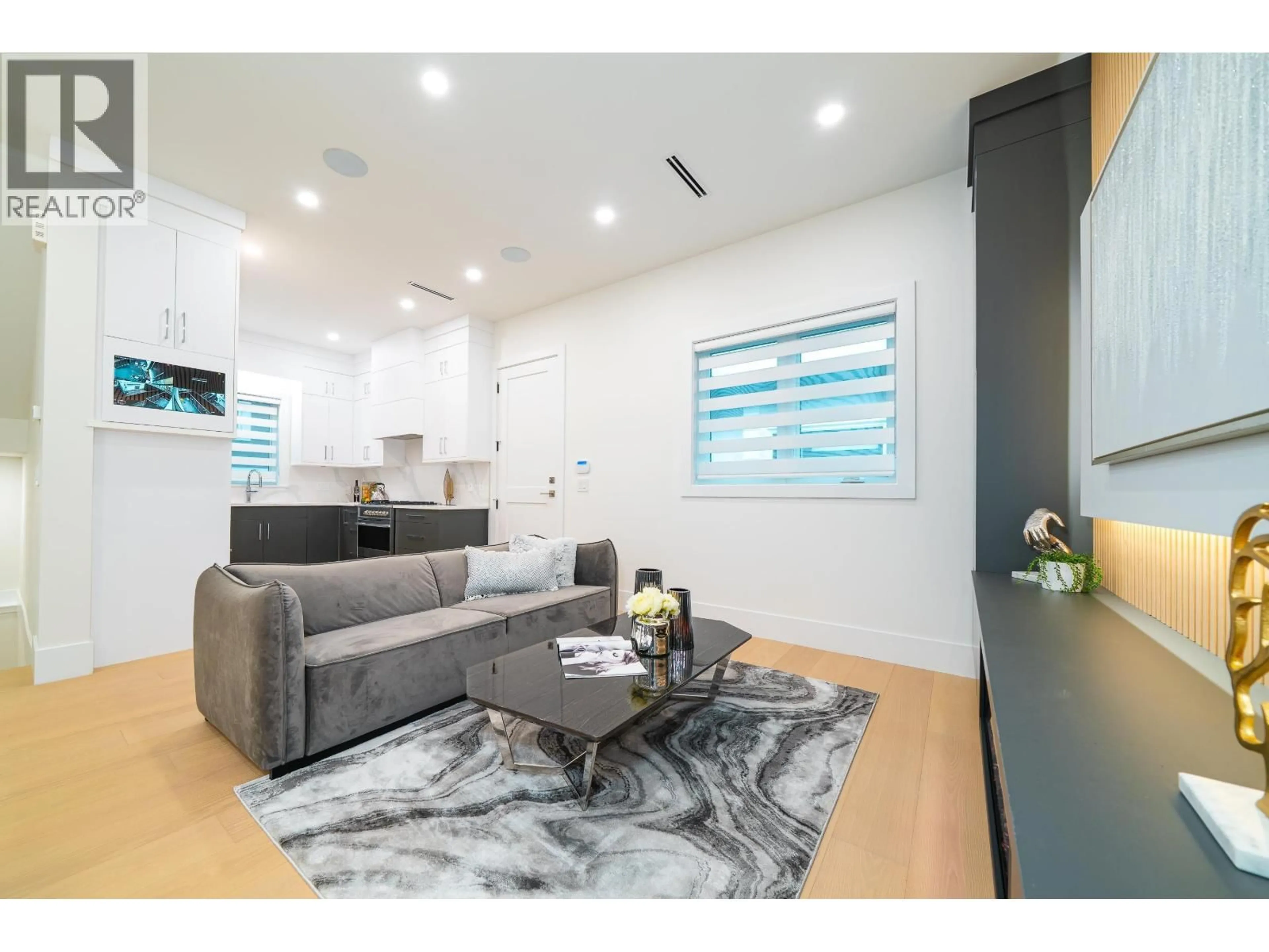 Living room with furniture, wood/laminate floor for 2 - 4210 UNION STREET, Burnaby British Columbia V5C2X4