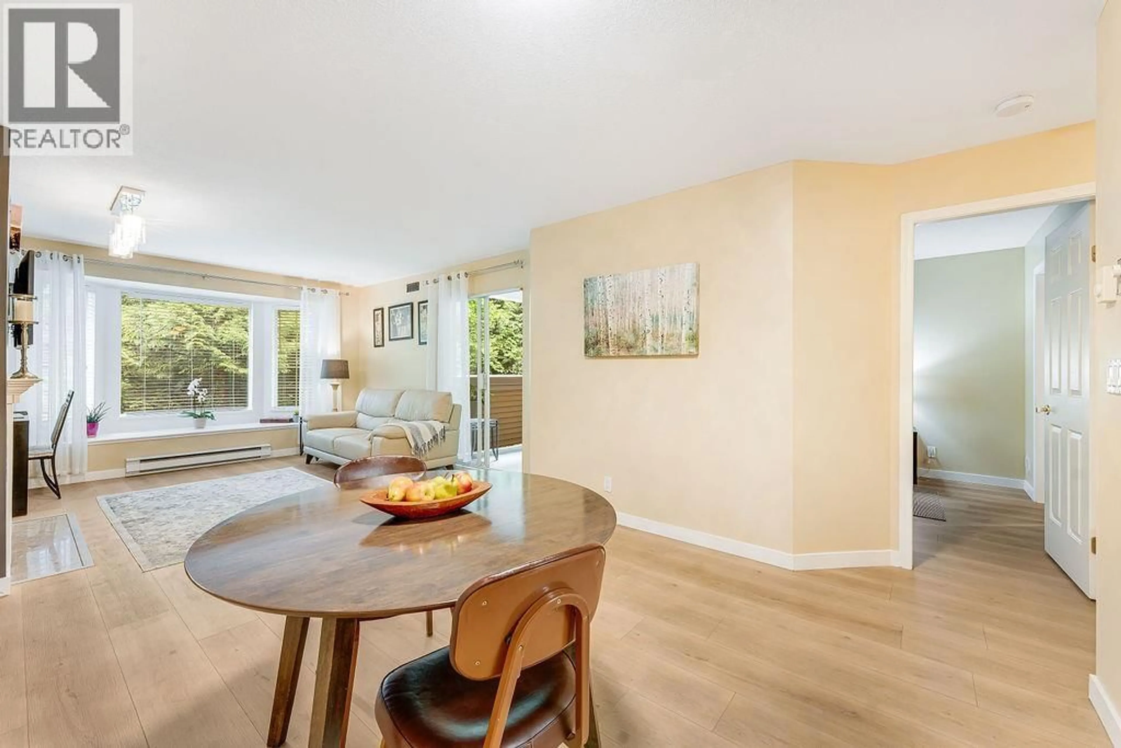 Living room with furniture, wood/laminate floor for 205 - 6860 RUMBLE STREET, Burnaby British Columbia V5E1A8