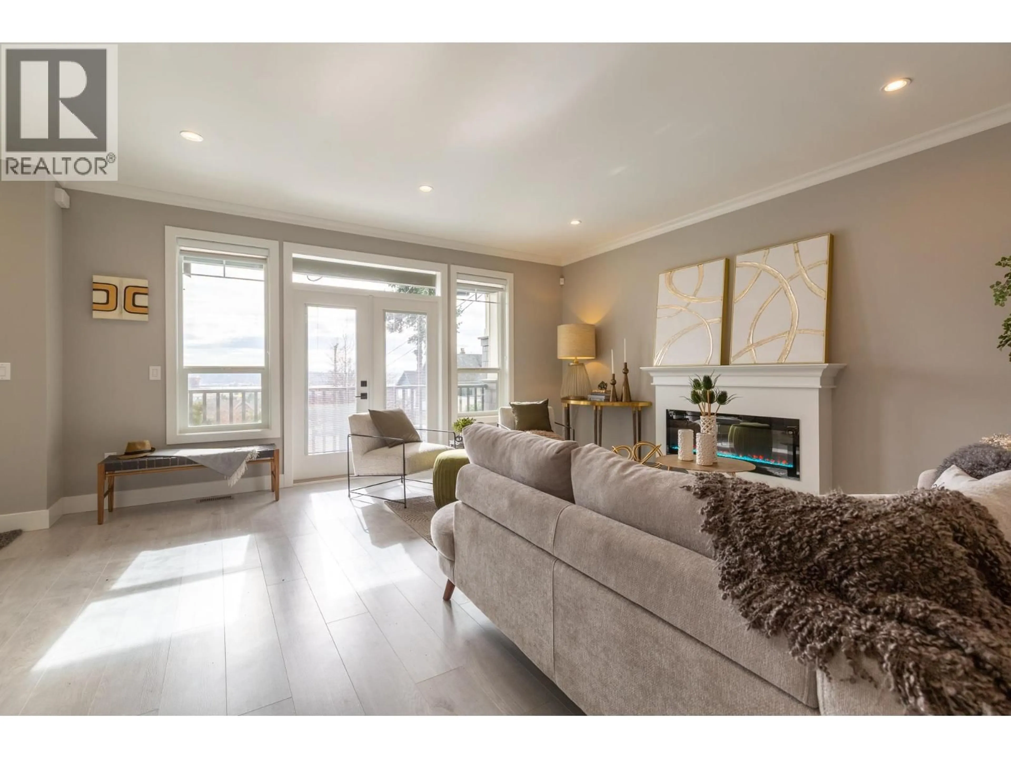 Living room with furniture, wood/laminate floor for 1 - 1211 THOMAS AVENUE, Coquitlam British Columbia V3K2L1