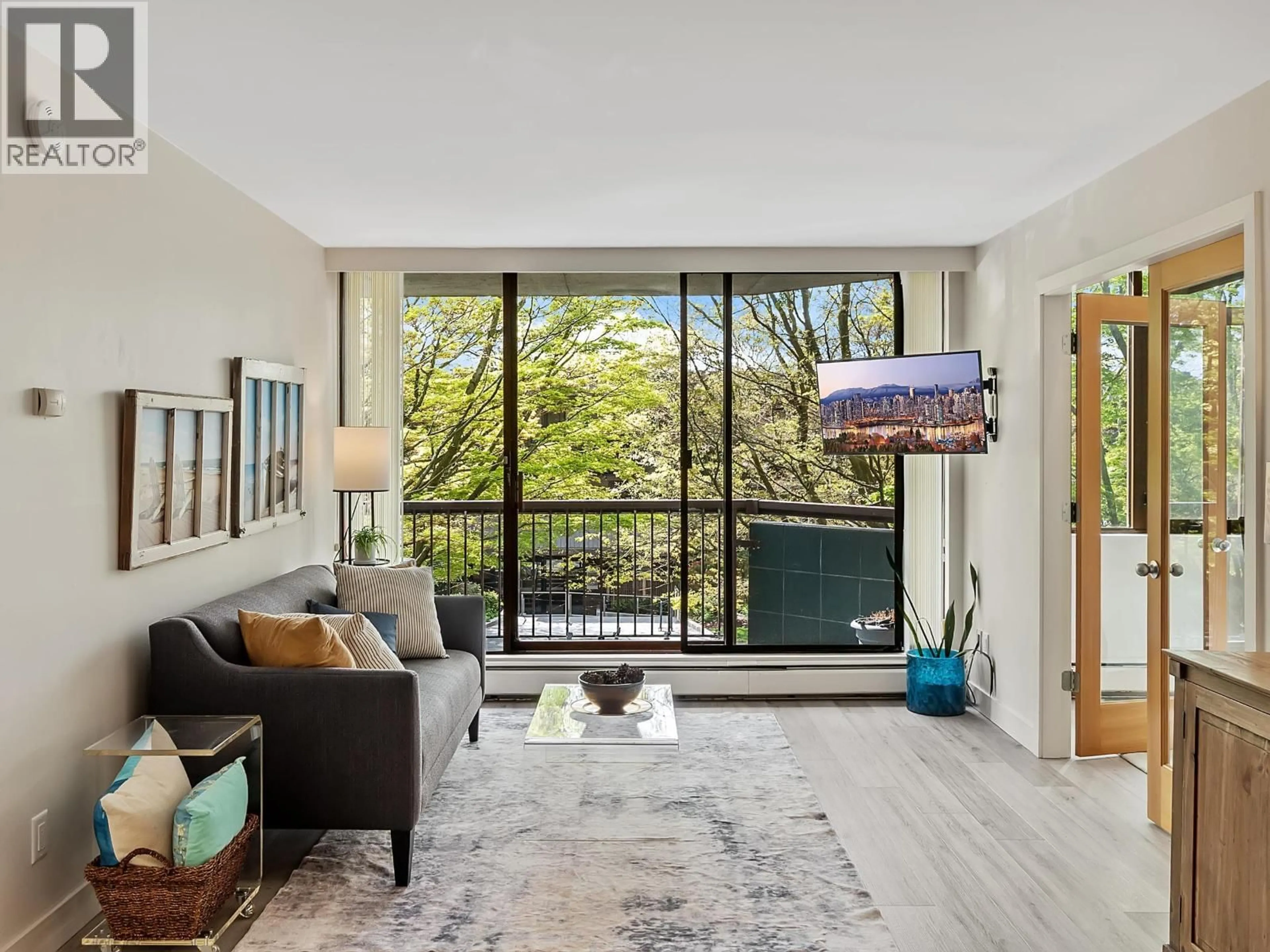 Living room with furniture, wood/laminate floor for 205 - 2445 3RD AVENUE, Vancouver British Columbia V6K4K6