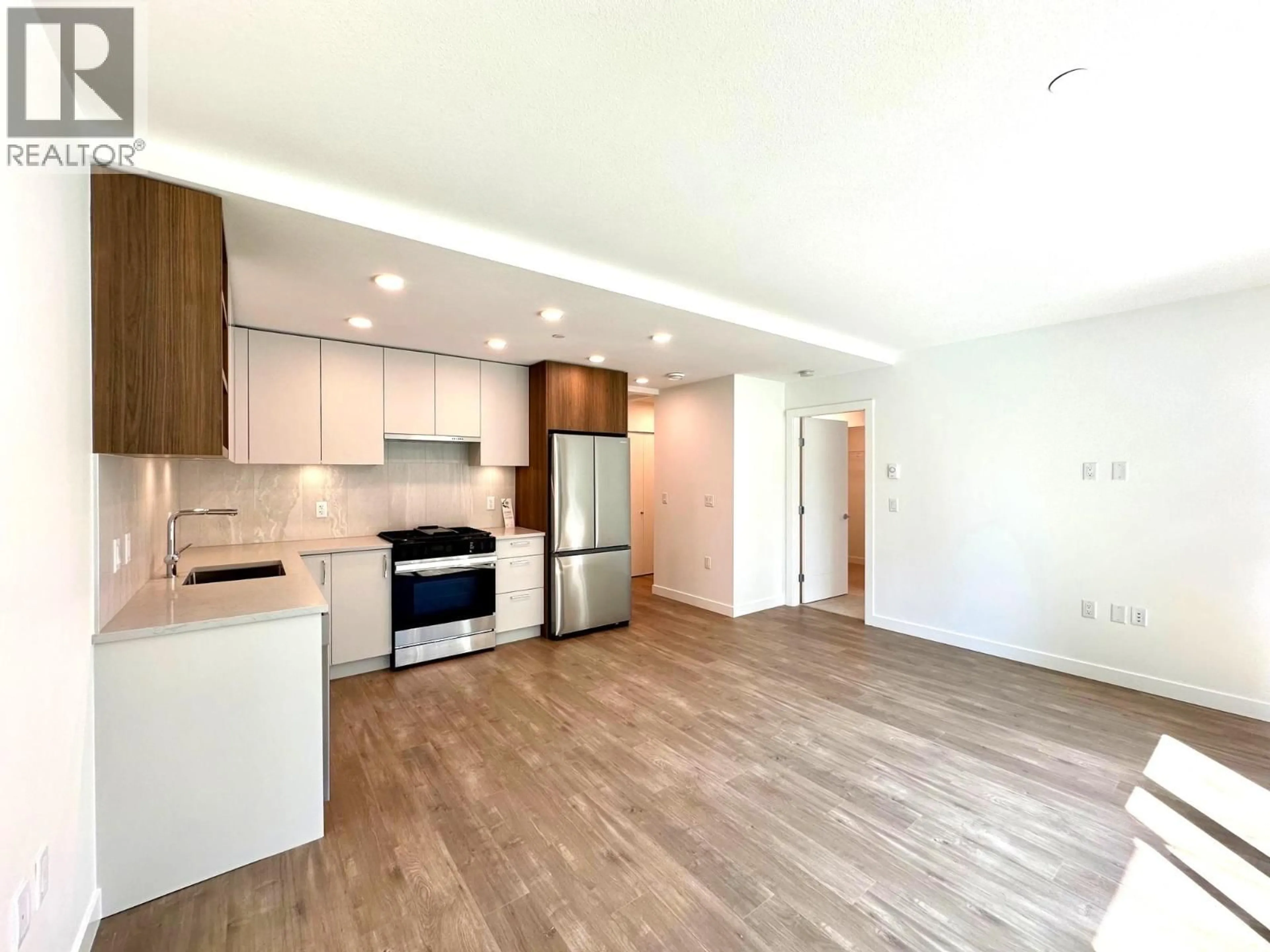 Open concept kitchen, wood/laminate floor for 313 - 723 GROVER AVENUE, Coquitlam British Columbia V3J0L9