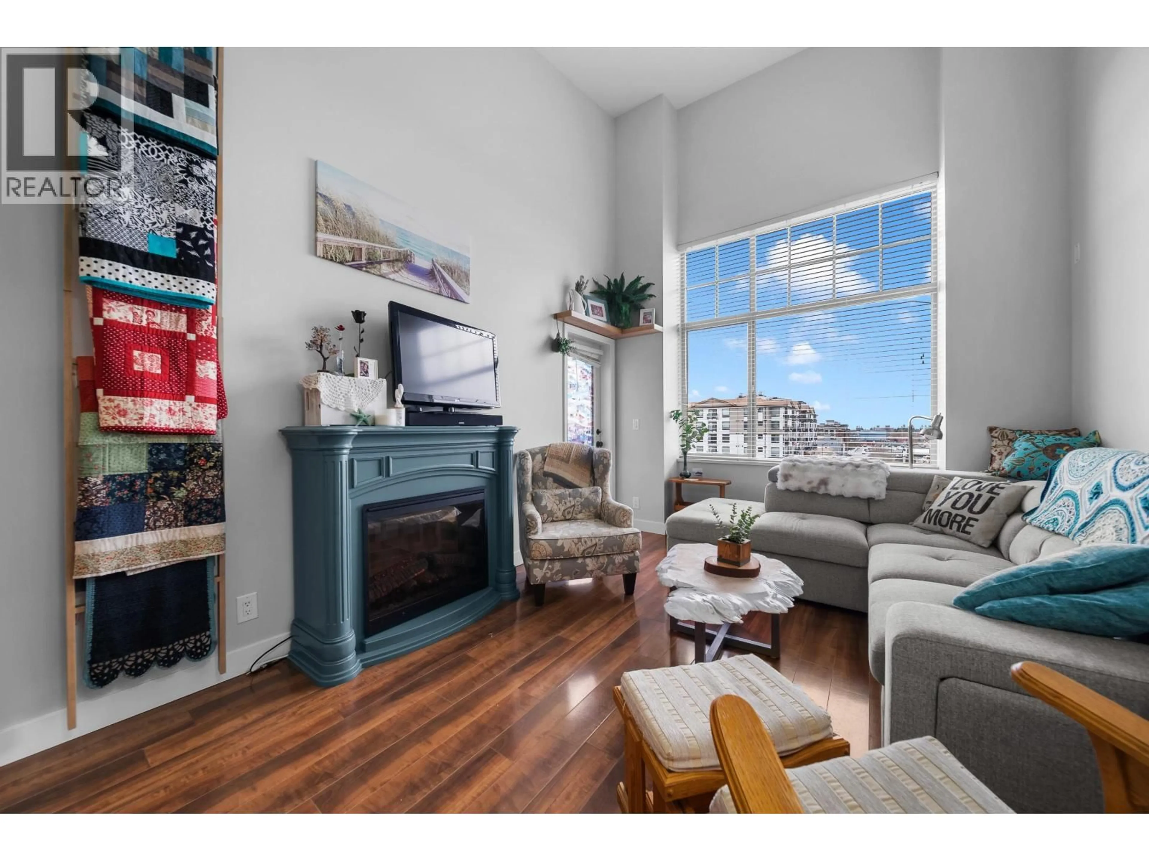 Living room with furniture, wood/laminate floor for 402 - 11935 BURNETT STREET, Maple Ridge British Columbia V2X9A9