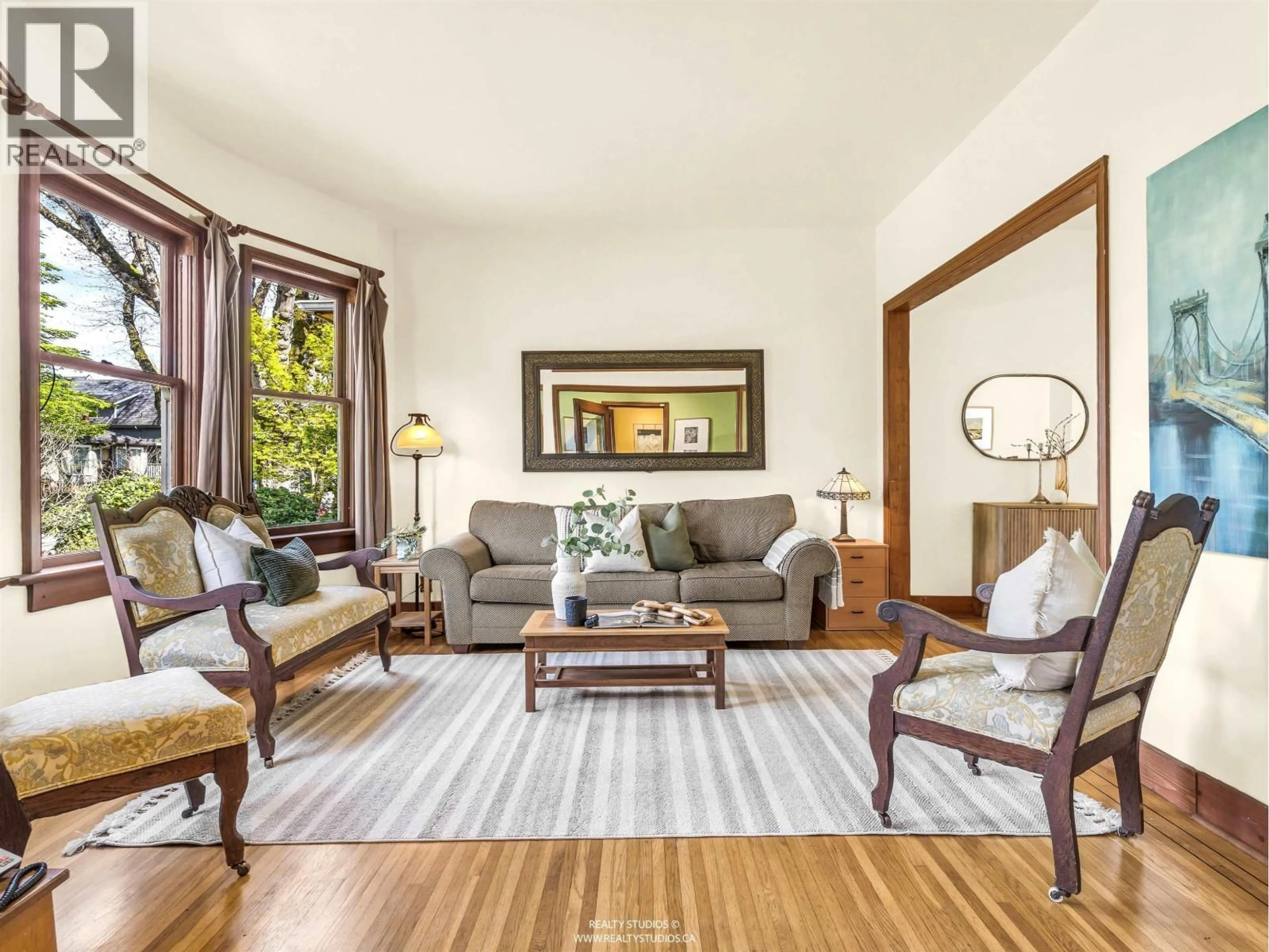 Living room with furniture, wood/laminate floor for 1756 7TH AVENUE, Vancouver British Columbia V5N1S2