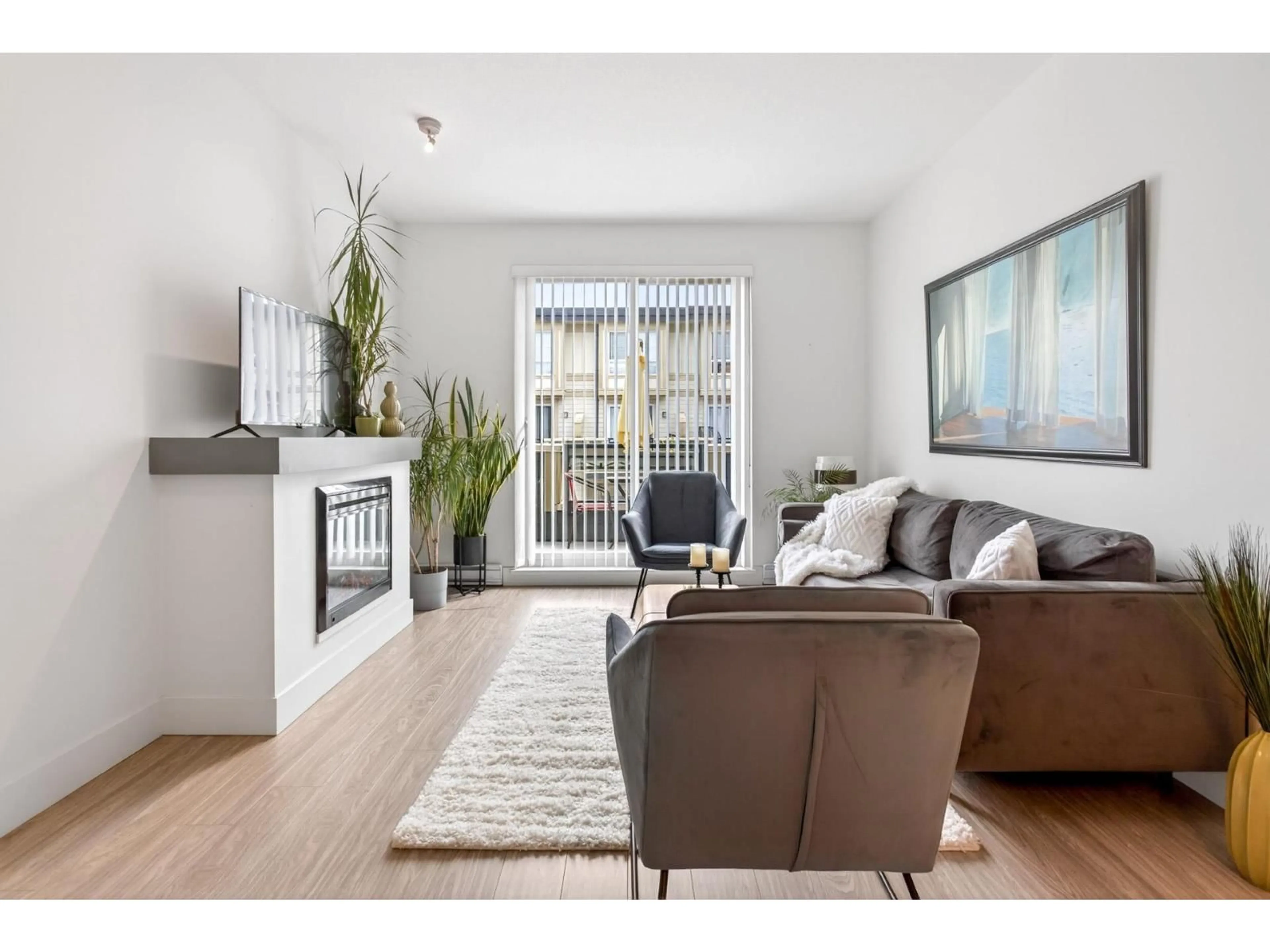 Living room with furniture, wood/laminate floor for 48 - 19477 72A AVENUE, Surrey British Columbia V4N6M2