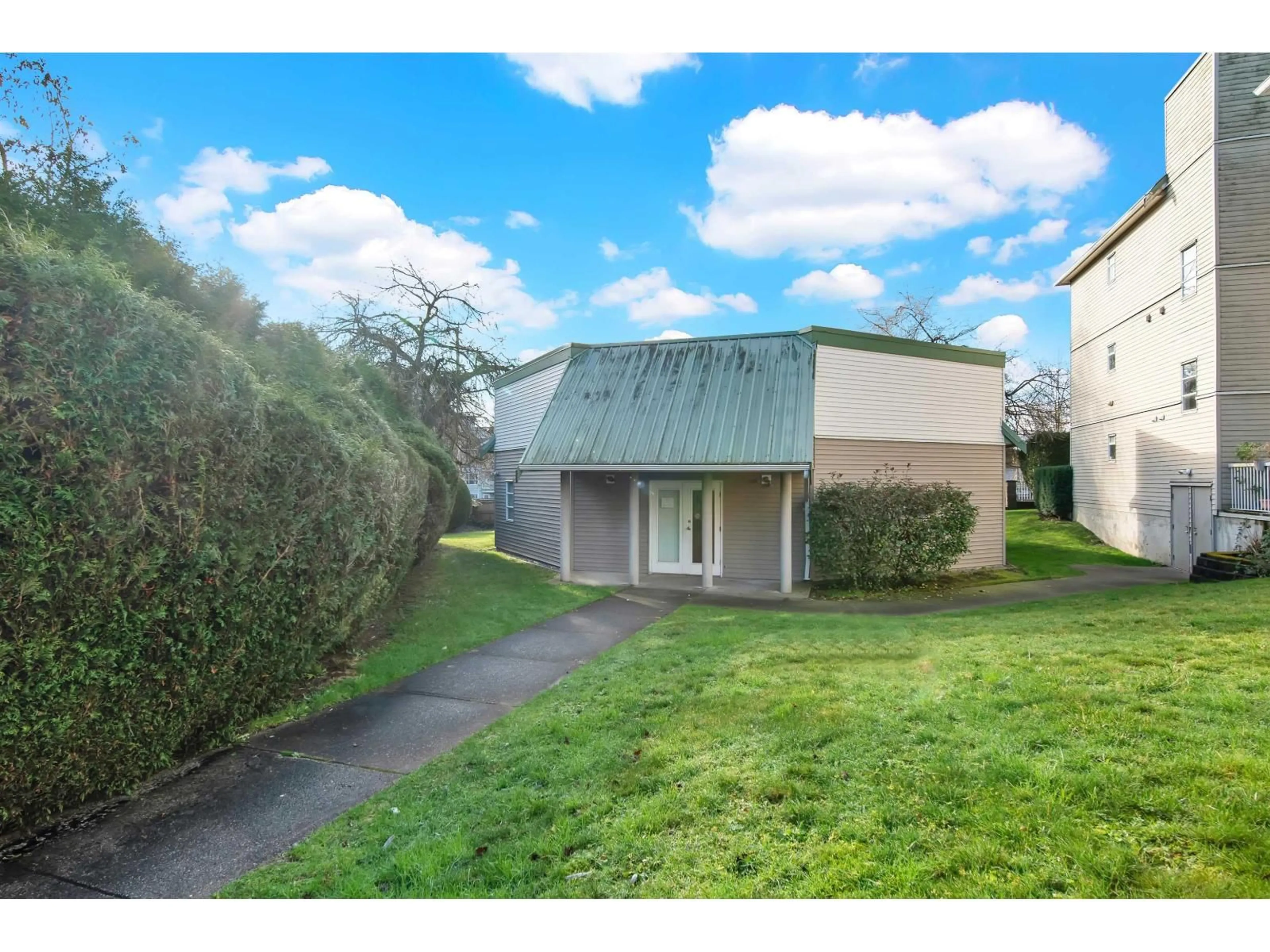 A pic from outside/outdoor area/front of a property/back of a property/a pic from drone, street for 102 - 9765 140 STREET, Surrey British Columbia V3T5S5