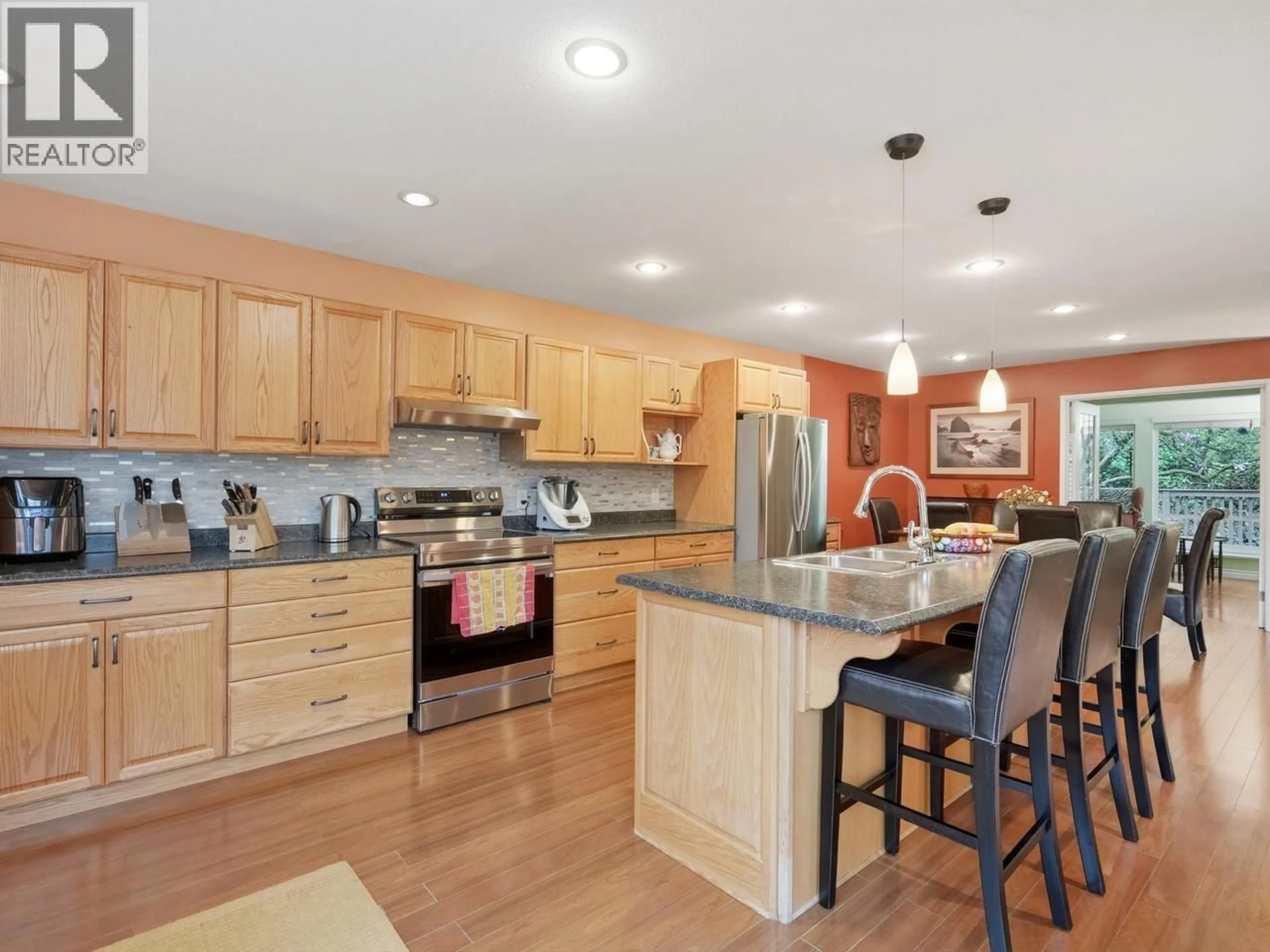 Open concept kitchen, wood/laminate floor for 9439 SNOWBERRY COURT, Burnaby British Columbia V5A4A6