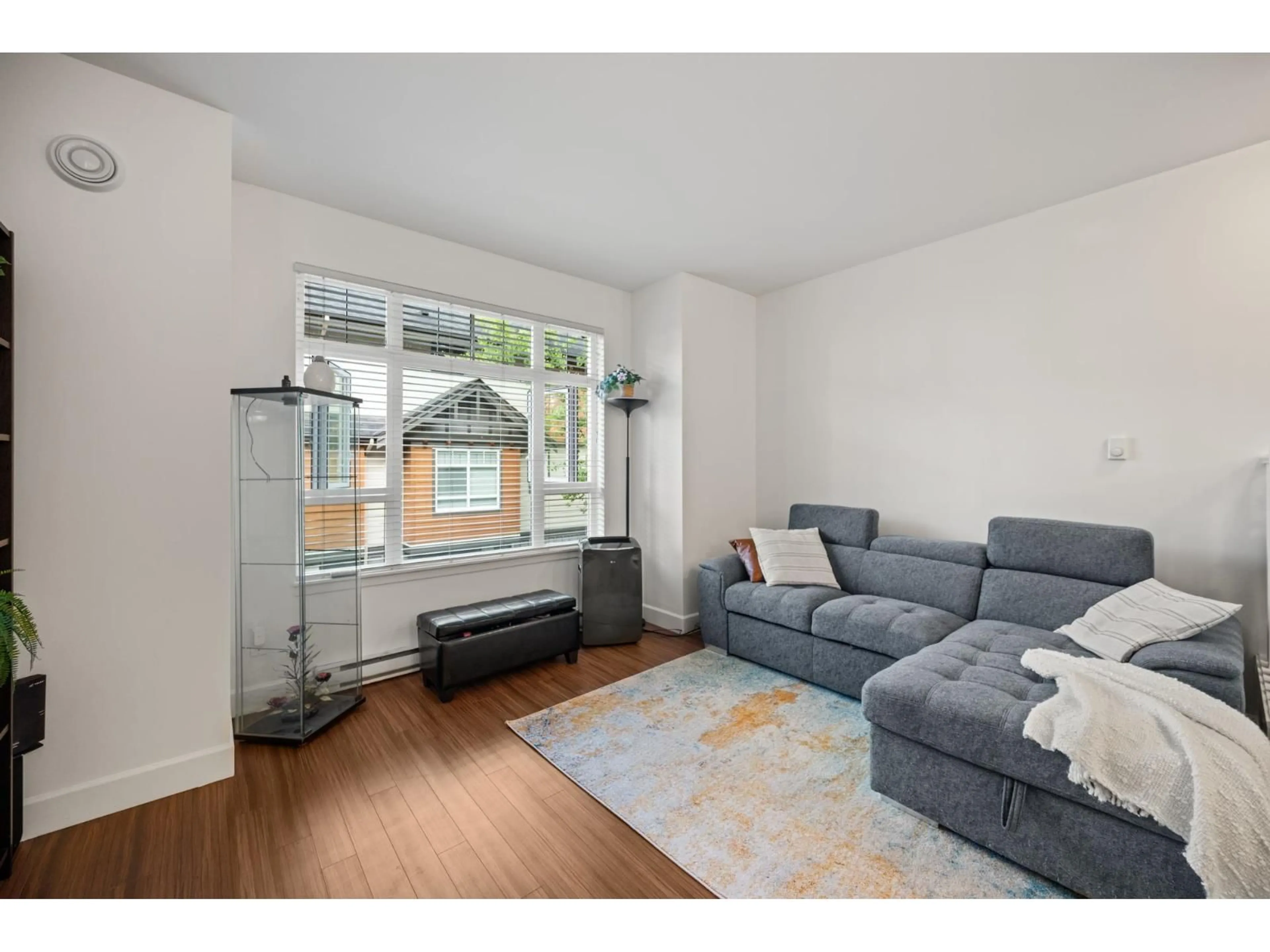 Living room with furniture, wood/laminate floor for 101 - 2979 156 STREET, Surrey British Columbia V3Z8V8