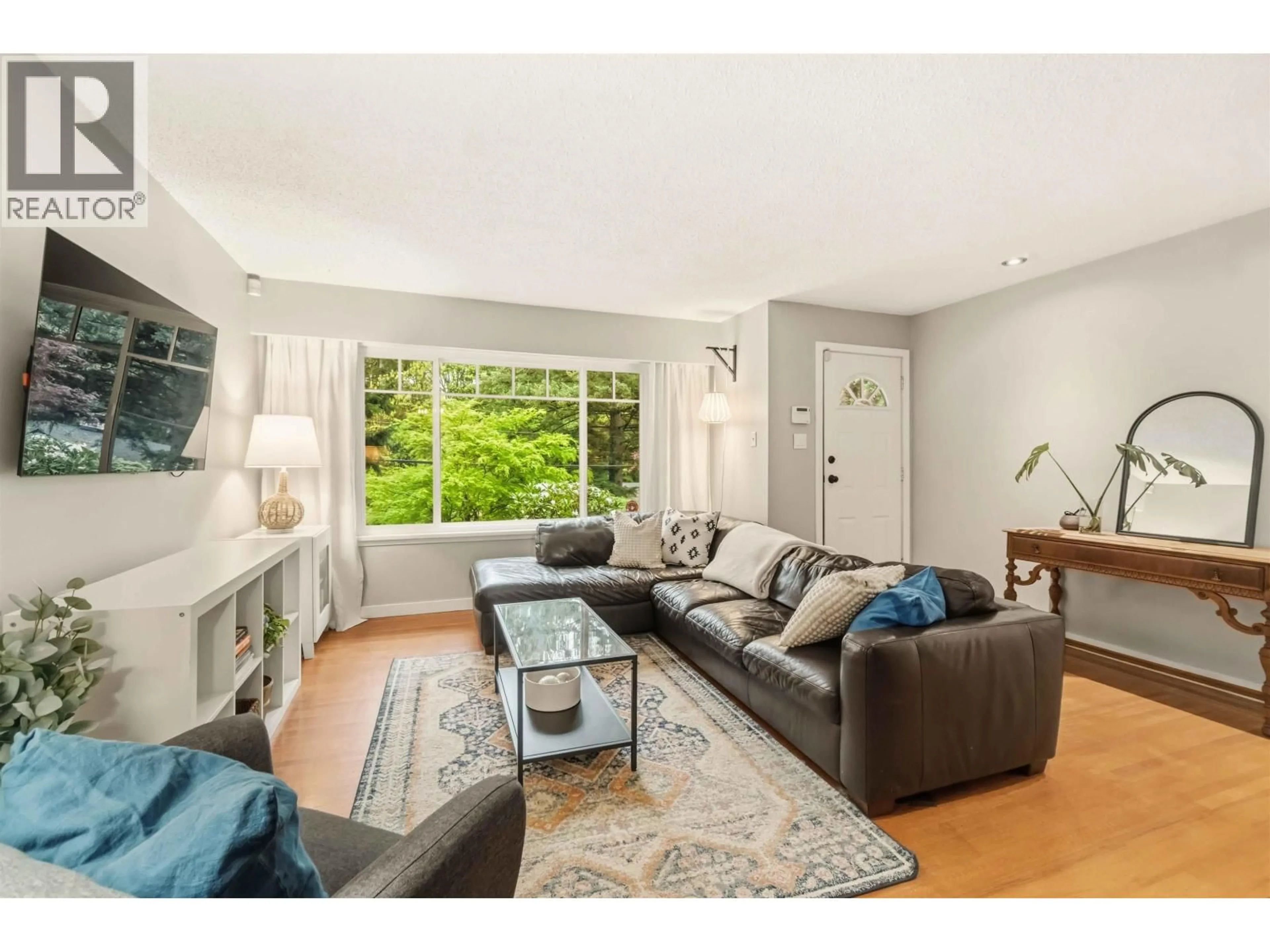 Living room with furniture, wood/laminate floor for 209 CLEARVIEW DRIVE, Port Moody British Columbia V3H2S7