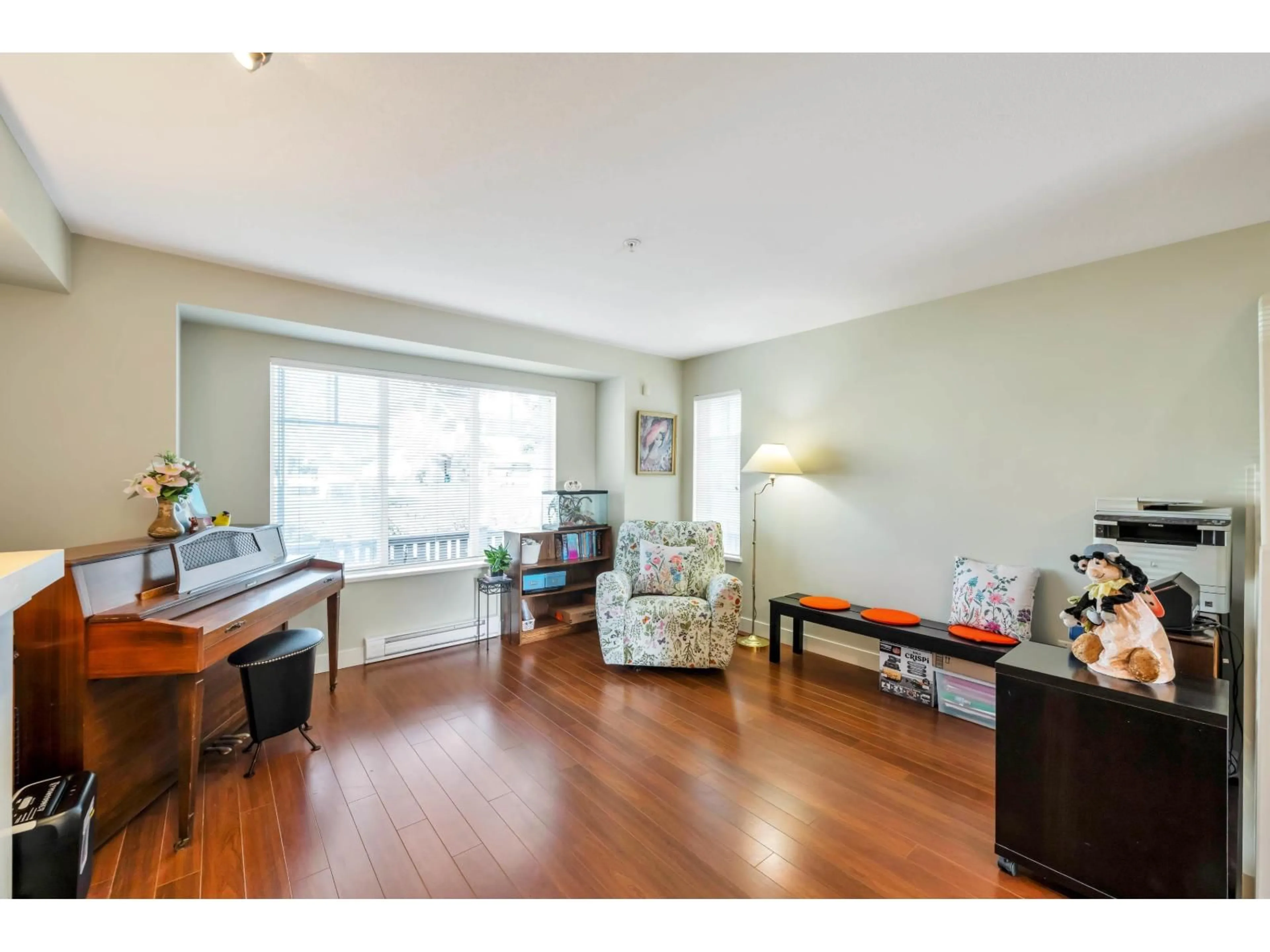 Living room with furniture, wood/laminate floor for 1 - 20038 70 AVENUE, Langley British Columbia V2Y0B4