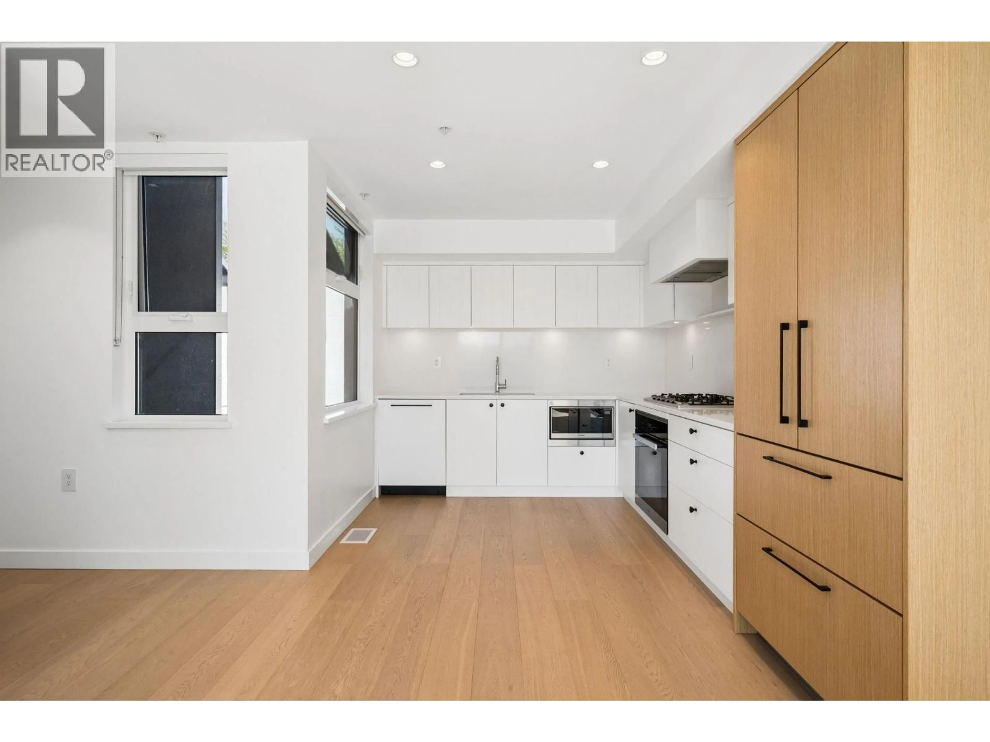 Open concept kitchen, unknown for 211 - 90 KING EDWARD AVENUE, Vancouver British Columbia V5Y0N6