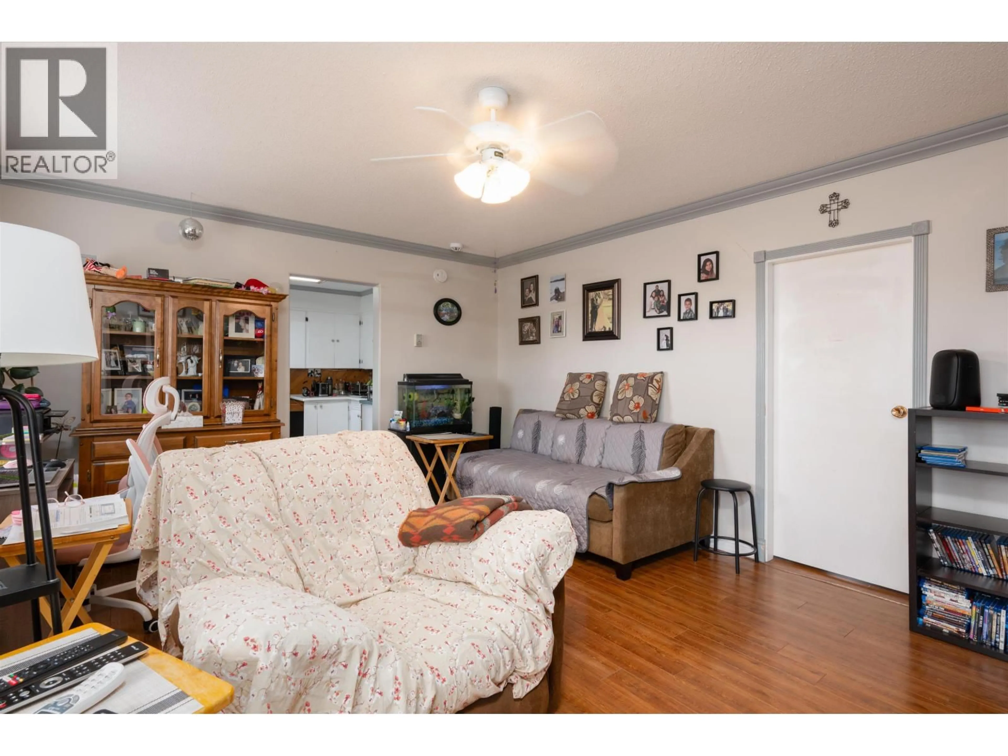 Living room with furniture, wood/laminate floor for 3610 BLACKBURN ROAD, Prince George British Columbia V2N6C2