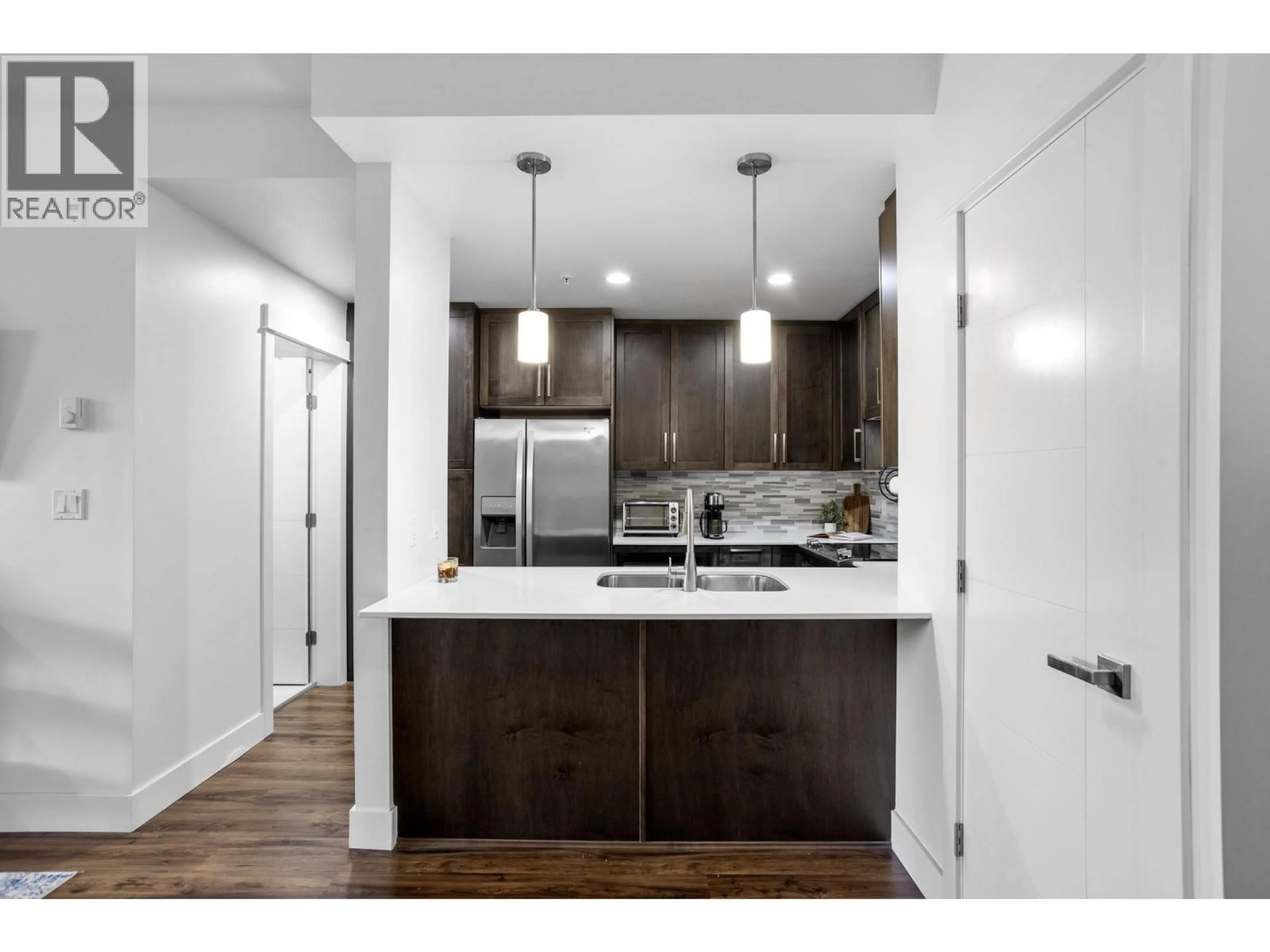 Open concept kitchen, wood/laminate floor for 311 - 2465 WILSON AVENUE, Port Coquitlam British Columbia V3C0E6