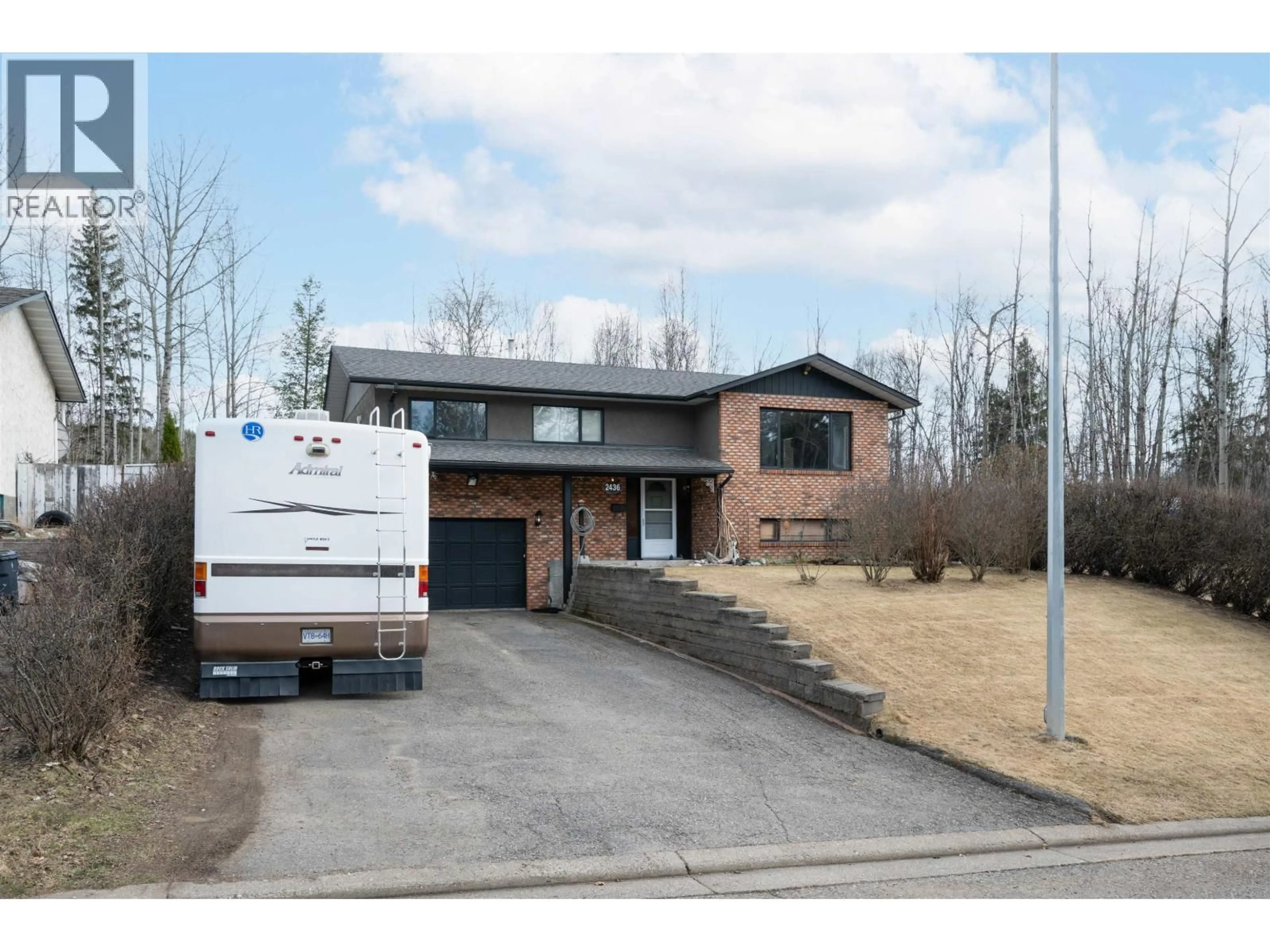 Home with brick exterior material, street for 2436 MOSS AVENUE, Prince George British Columbia V2L5J3