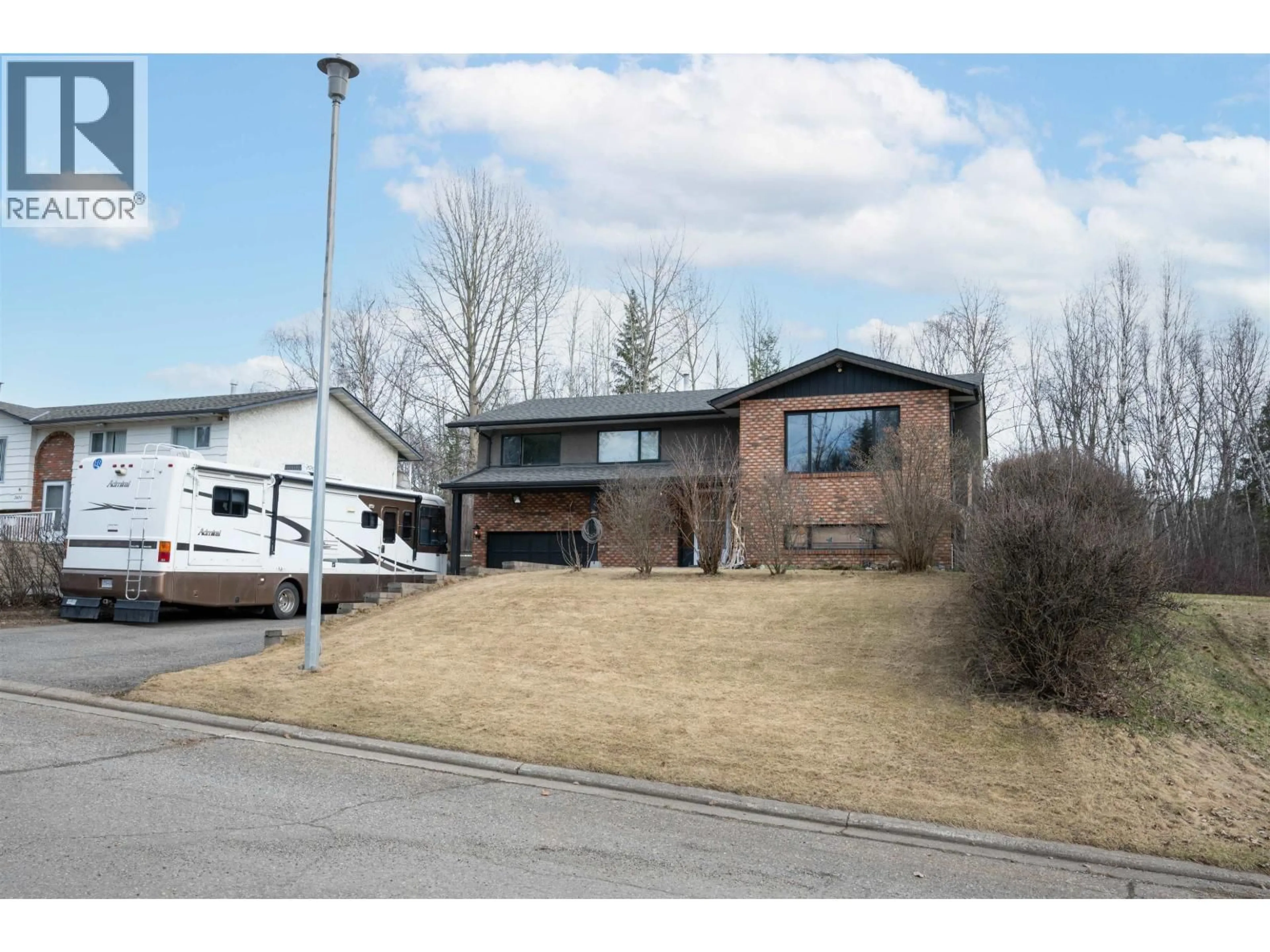 Home with brick exterior material, street for 2436 MOSS AVENUE, Prince George British Columbia V2L5J3