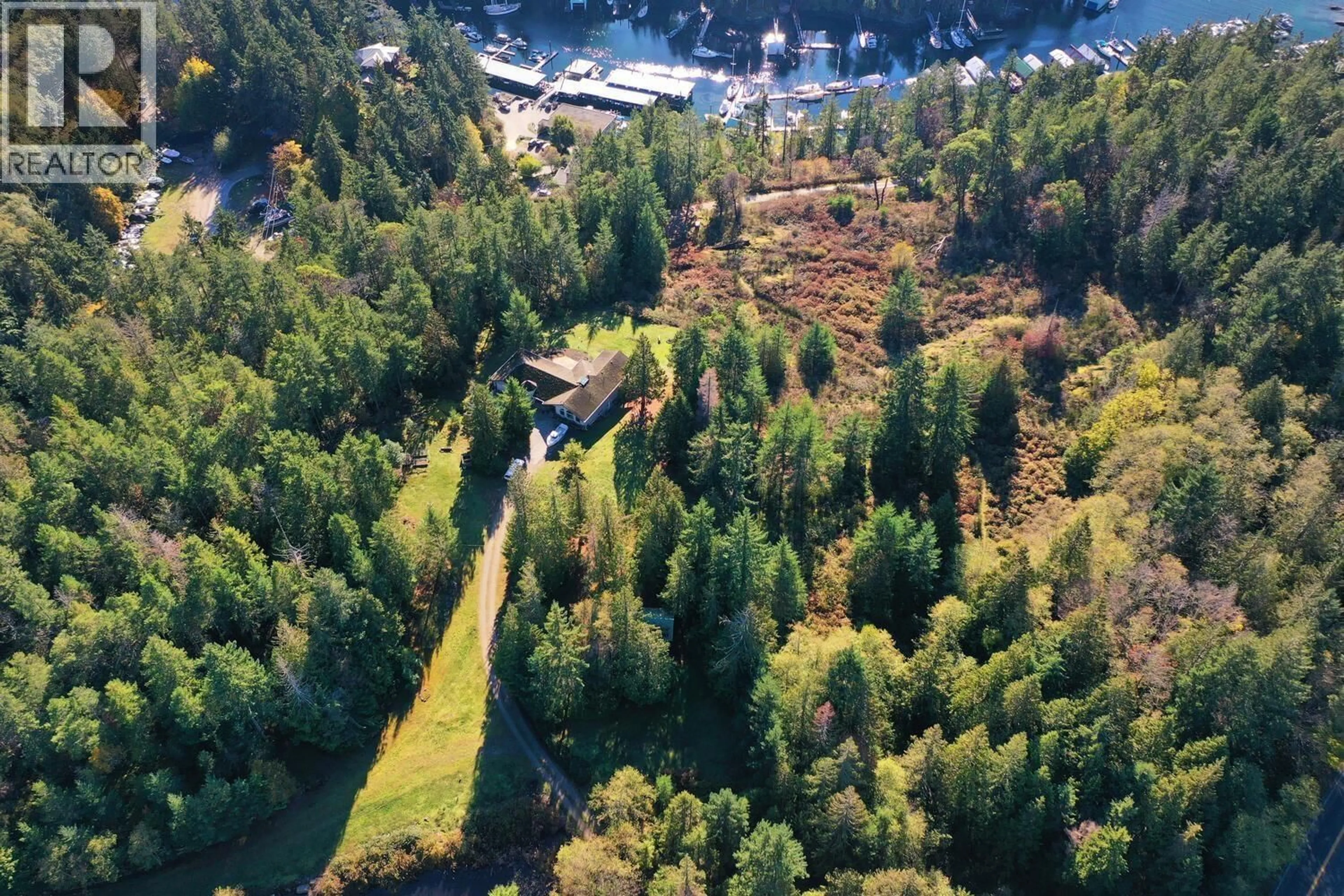 A pic from outside/outdoor area/front of a property/back of a property/a pic from drone, forest/trees view for 10113 - 10131 MERCER ROAD, Halfmoon Bay British Columbia V7Z1B7