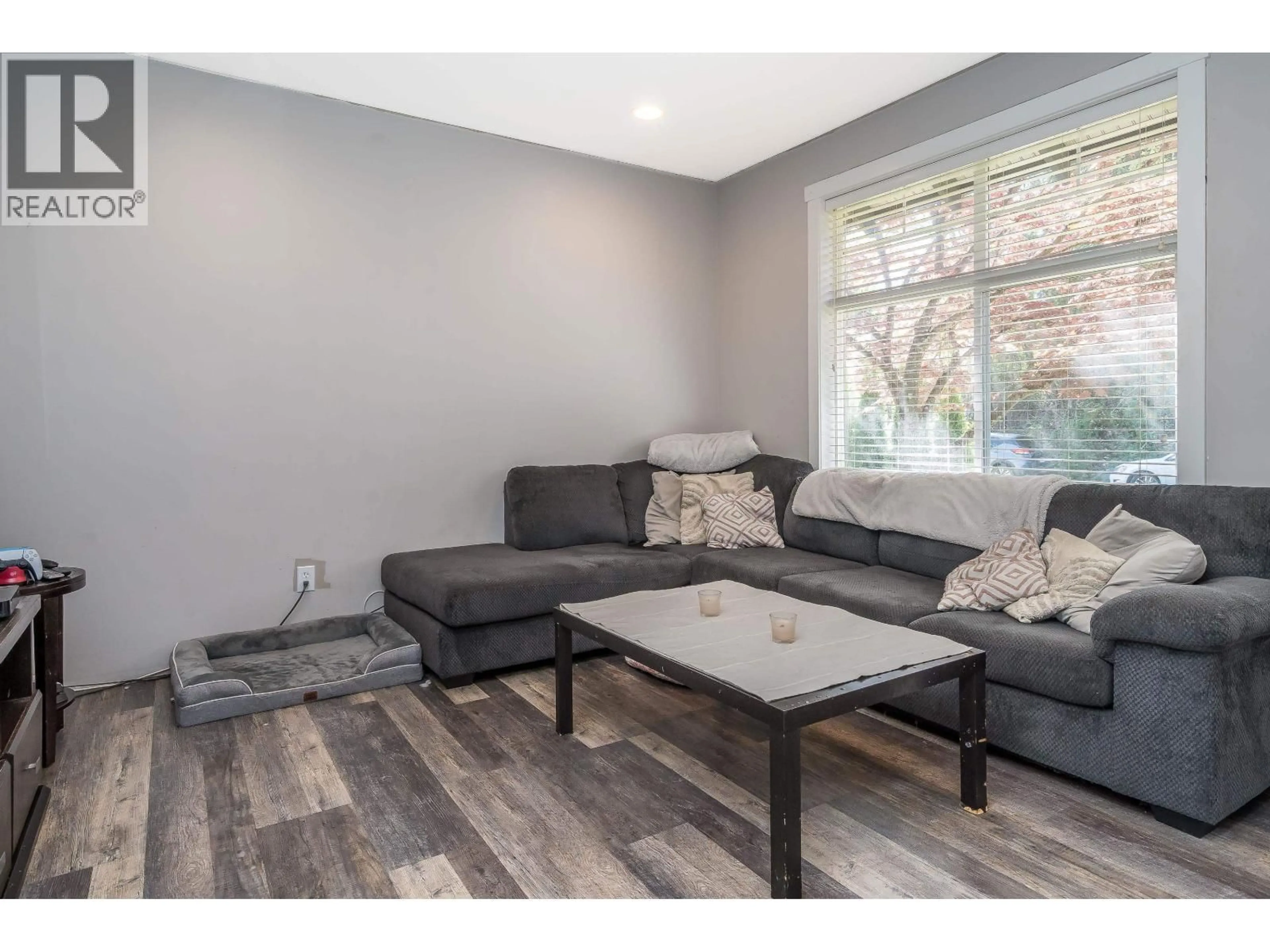 Living room with furniture, wood/laminate floor for 22843 136A AVENUE, Maple Ridge British Columbia V4R0B4